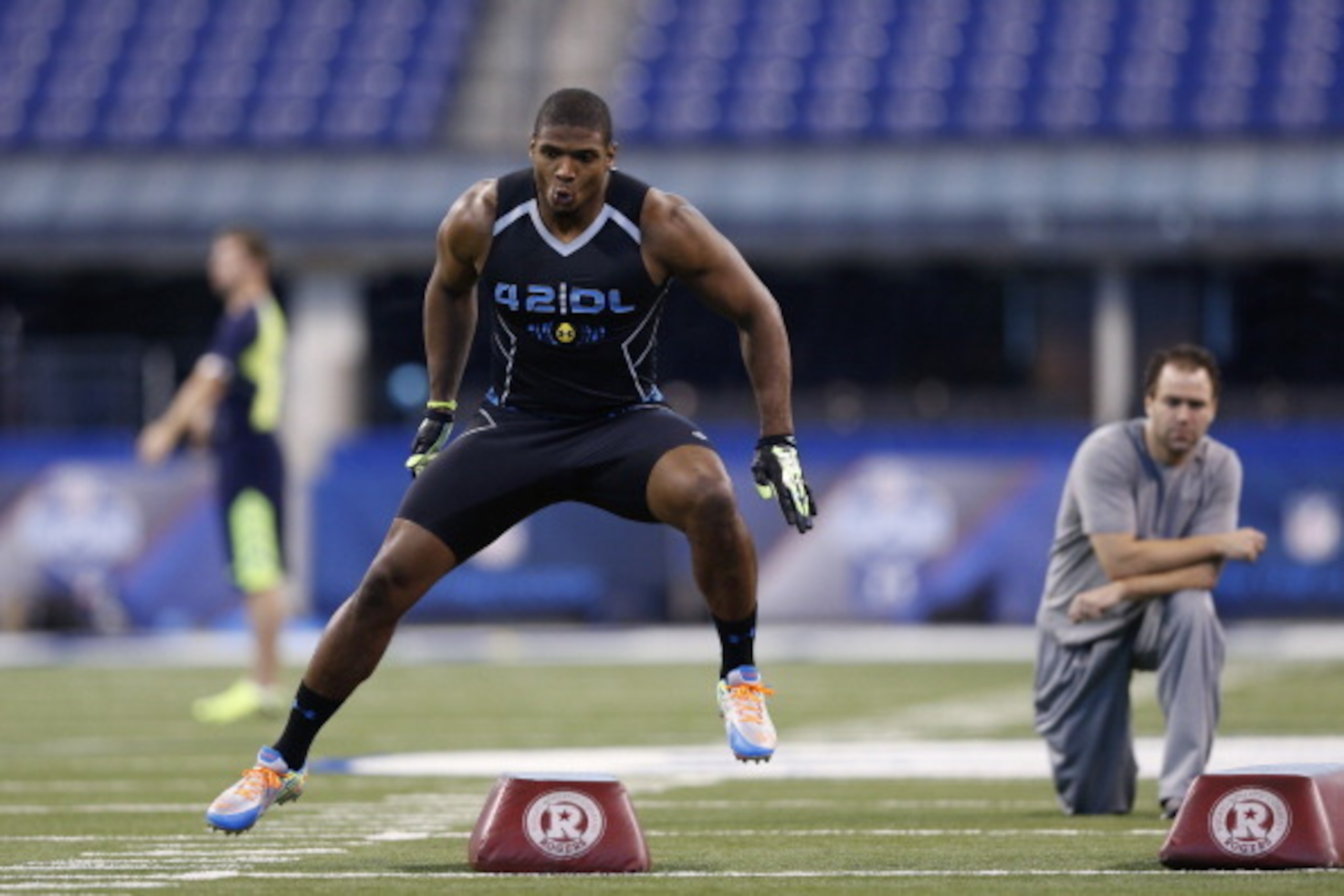 INDIANAPOLIS, IN - FEBRUARY 24: Former Missouri defensive lineman Michael Sam takes part in position drills during the 2014 NFL Combine at Lucas Oil Stadium on February 24, 2014 in Indianapolis, Indiana. (Photo by Joe Robbins/Getty Images)