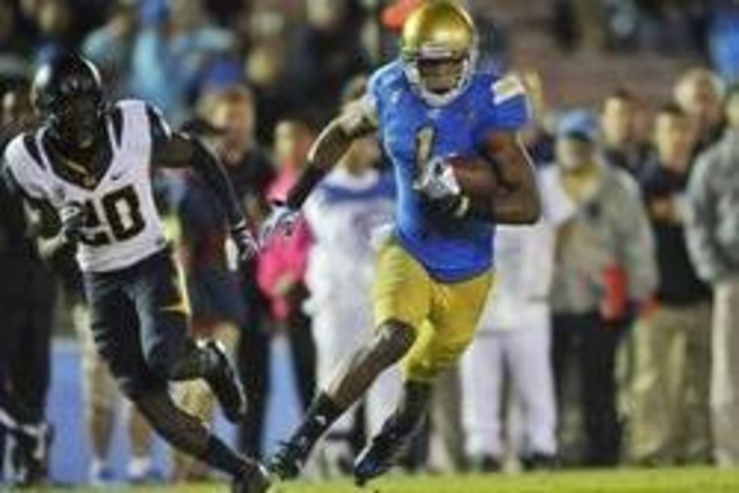 October 12, 2013; Pasadena, CA, USA; UCLA Bruins wide receiver Shaquelle Evans (1) runs the ball to score a touchdown against the California Golden Bears during the second half at the Rose Bowl. Mandatory Credit: Gary A. Vasquez-USA TODAY Sports