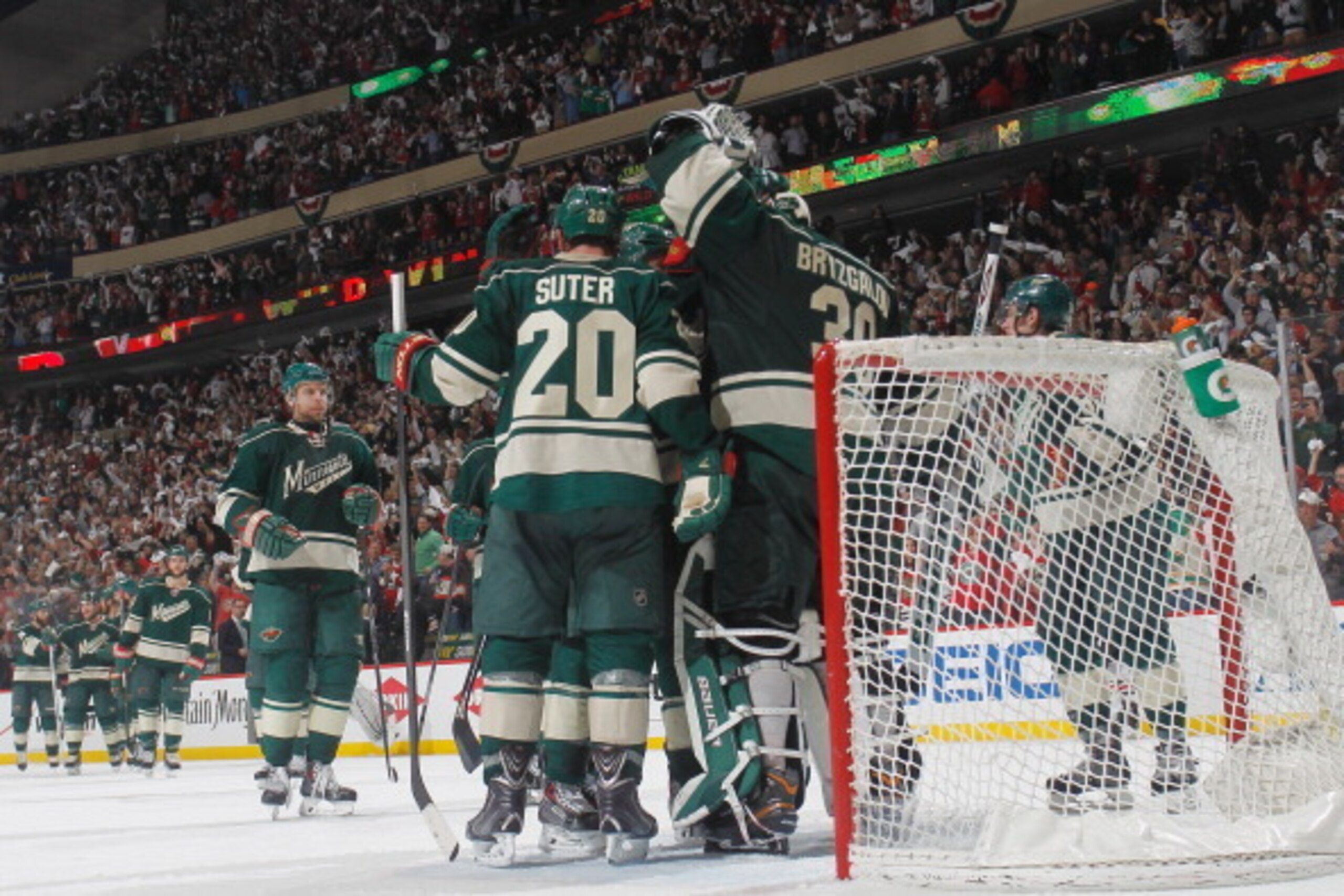 ST. PAUL, MN - MAY 9: (L-R) Ryan Suter #20 and Ilya Bryzgalov #30 celebrate with their Minnesota Wild teammates after defeating the Chicago Blackhawks in Game Four of the Second Round of the 2014 Stanley Cup Playoffs on May 9, 2014 at the Xcel Energy Cent