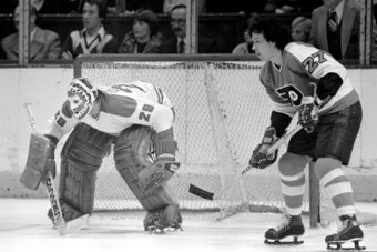 MONTREAL, CANADA - CIRCA 1976:  Ken Dryden #29 of the Montreal Canadiens guards the net during against Reggie Leach #27 of the Philadelphia Flyers circa 1976 in Montreal, Quebec, Canada. (Photo by Denis Brodeur/NHLI via Getty Images)