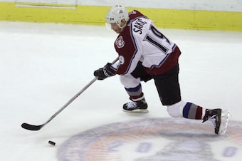 9 Jun 2001:  Joe Sakic #19 of the Colorado Avalanche brings the cup down ice against the New Jersey Devils during game seven of the Stanley Cup finals at the Pepsi Center in Denver, Colorado.  DIGITAL IMAGE Mandatory Credit: Brian Bahr/ALLSPORT