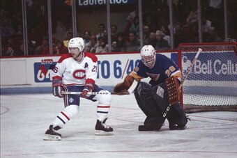 Canadiens forward Mats Naslund #26 in close against Blues goaltender Greg Millen #29 at the Montreal Forum during the 1987-88 season.(Photo by Denis Brodeur/NHLI via Getty Images)