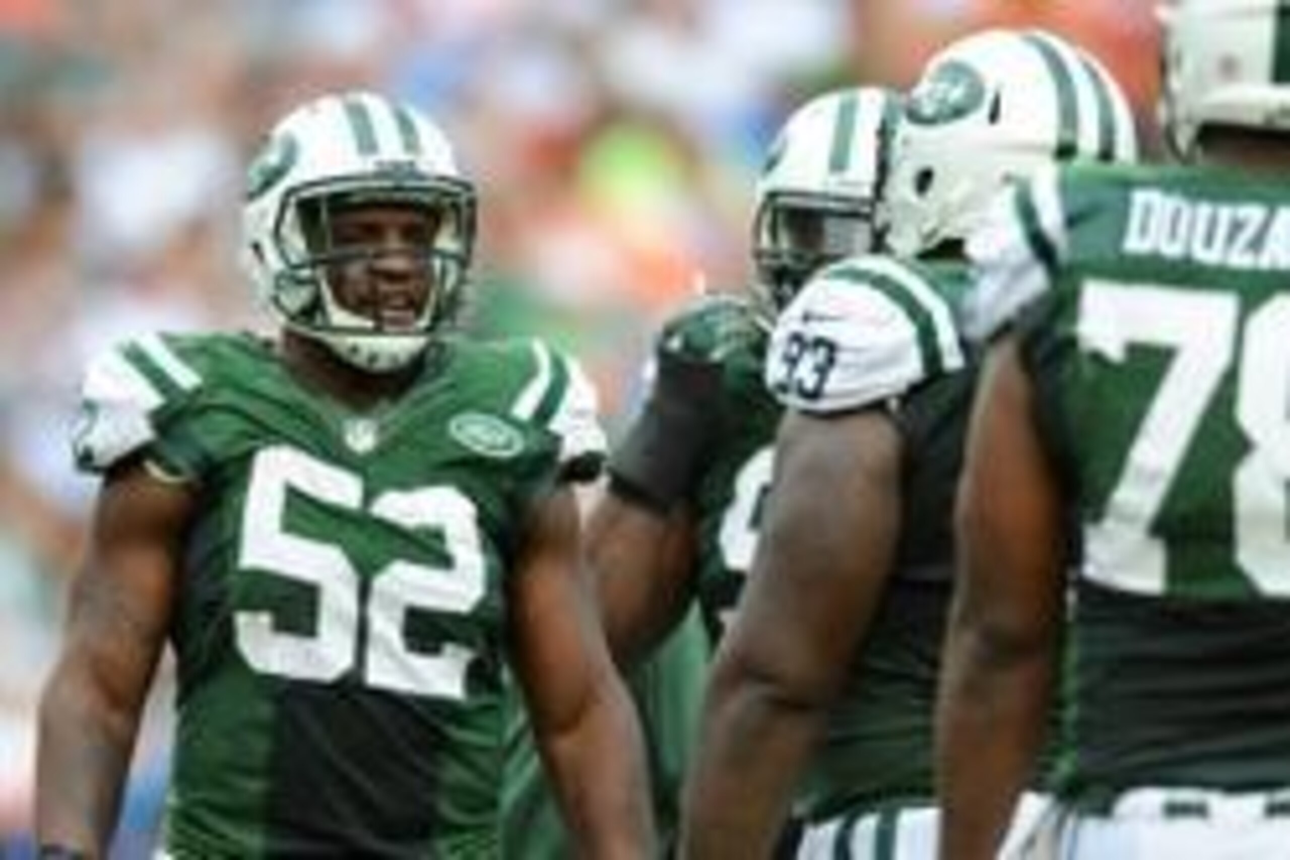 Dec 29, 2013; Miami Gardens, FL, USA; New York Jets inside linebacker David Harris (52) at the line of scrimmage against the Miami Dolphins at Sun Life Stadium. Mandatory Credit: Steve Mitchell-USA TODAY Sports