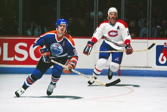 MONTREAL 1980's: Mark Messier #11 of the Edmonton Oilers skates against Larry Robinson #19 of the Montreal Canadiens in the 1980's at the Montreal Forum in Montreal, Quebec, Canada. (Photo by Denis Brodeur/NHLI via Getty Images)