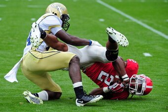ATLANTA, GA - NOVEMBER 26: Brandon Boykin #2 of the Georgia Bulldogs is tackled by Jemea Thomas #14 of the Georgia Tech Yellow Jackets at Bobby Dodd Stadium on November 26, 2011 in Atlanta, Georgia. (Photo by Scott Cunningham/Getty Images)