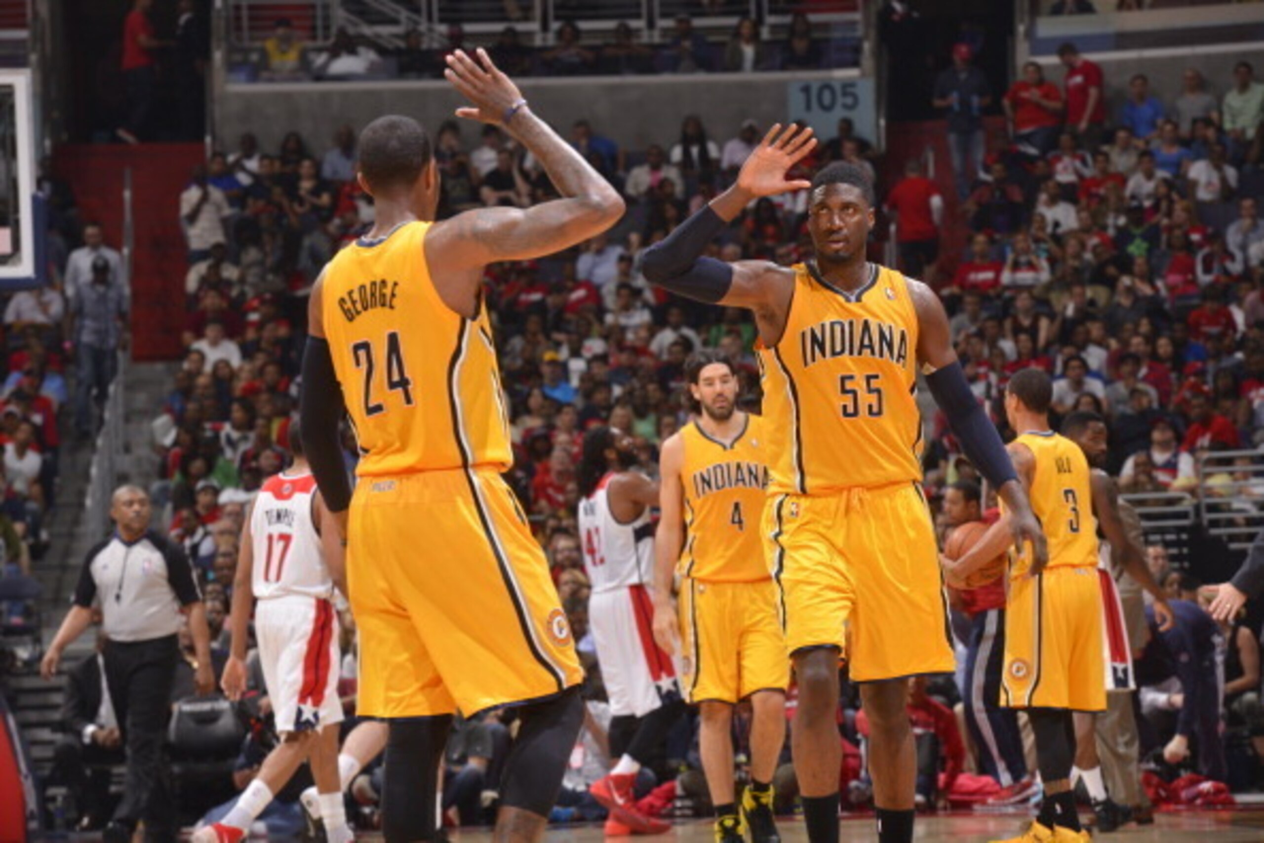 WASHINGTON, DC - MAY 09: Paul George #24 and Roy Hibbert #55 of the Indiana Pacers celebrate during Game Three of the Eastern Conference Semifinals against the Washington Wizards at Verizon Center on May 9, 2014 in Washington, DC. NOTE TO USER: User expre