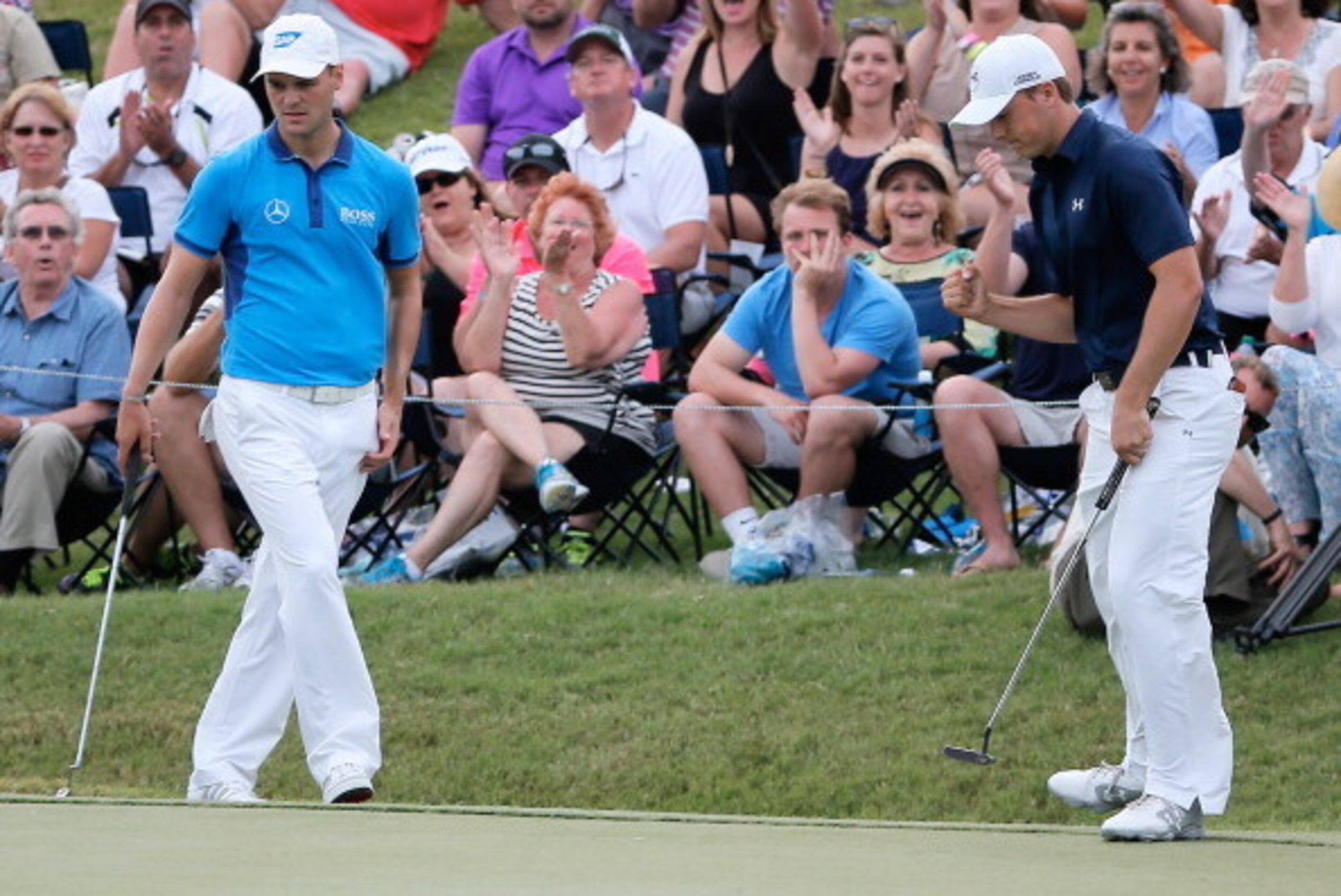 PONTE VEDRA BEACH, FL - MAY 10:  Jordan Spieth of the United States (R) saves par on the 18th hole as Martin Kaymer of Germany look on during the third round of THE PLAYERS Championship on the stadium course at TPC Sawgrass on May 10, 2014 in Ponte Vedra 