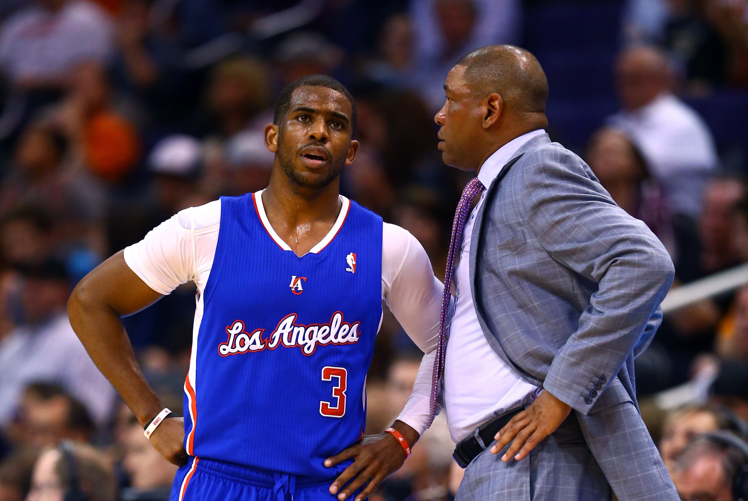 Mar 4, 2014; Phoenix, AZ, USA; Los Angeles Clippers guard Chris Paul (3) and head coach Doc Rivers against the Phoenix Suns at the US Airways Center. The Clippers defeated the Suns 104-96. Mandatory Credit: Mark J. Rebilas-USA TODAY Sports