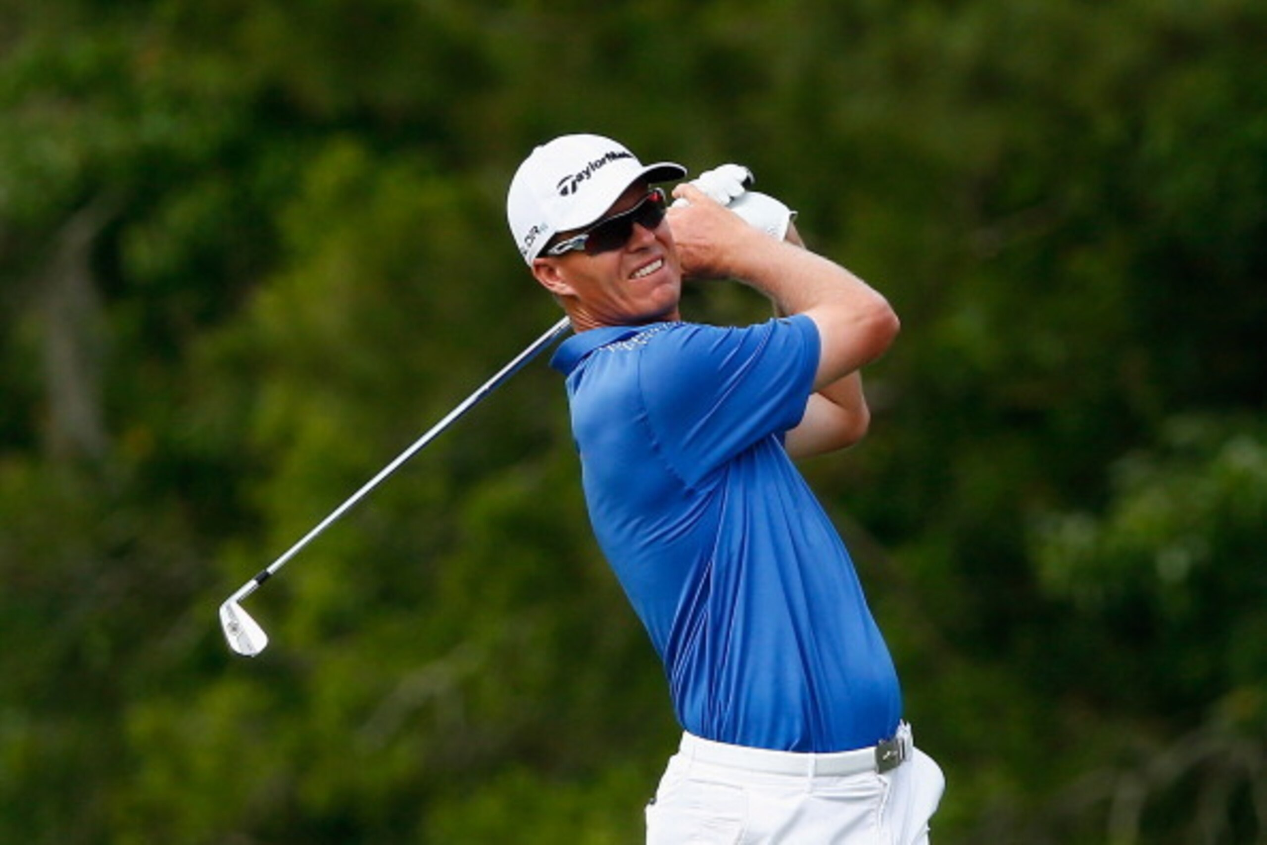 PONTE VEDRA BEACH, FL - MAY 10:  John Senden of Australia hits his approach shot on the 14th hole during the third round of THE PLAYERS Championship on the stadium course at TPC Sawgrass on May 10, 2014 in Ponte Vedra Beach, Florida.  (Photo by Sam Greenw