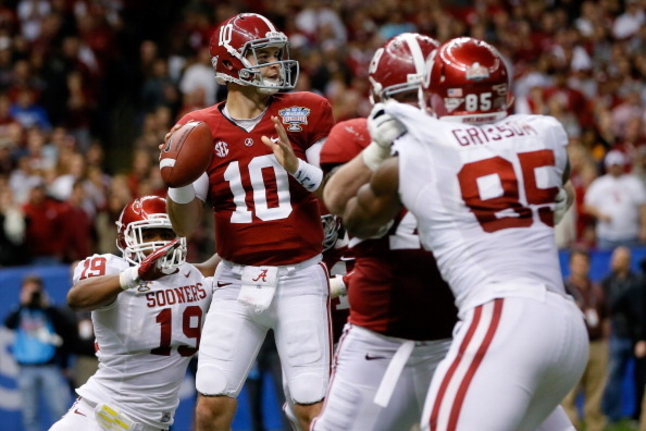 NEW ORLEANS, LA - JANUARY 02:  AJ McCarron #10 of the Alabama Crimson Tide has the ball stripped from him by Eric Striker #19 of the Oklahoma Sooners during the Allstate Sugar Bowl at the Mercedes-Benz Superdome on January 2, 2014 in New Orleans, Louisian