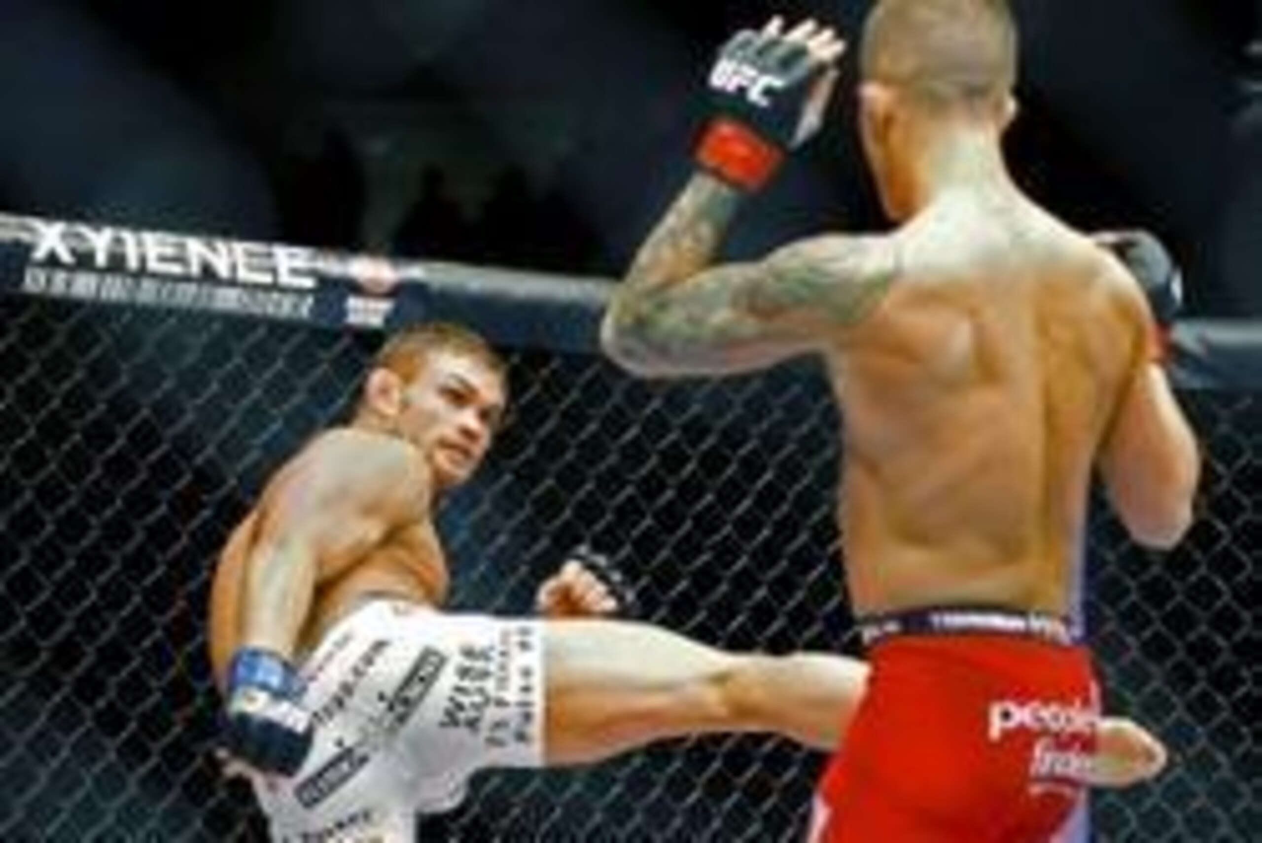 May 10, 2014; Cincinnati, OH, USA; Daron Cruickshank (blue gloves) fights Erik Koch (red gloves) during a lightweight bout at US Bank Arena. Mandatory Credit: Joe Maiorana-USA TODAY Sports