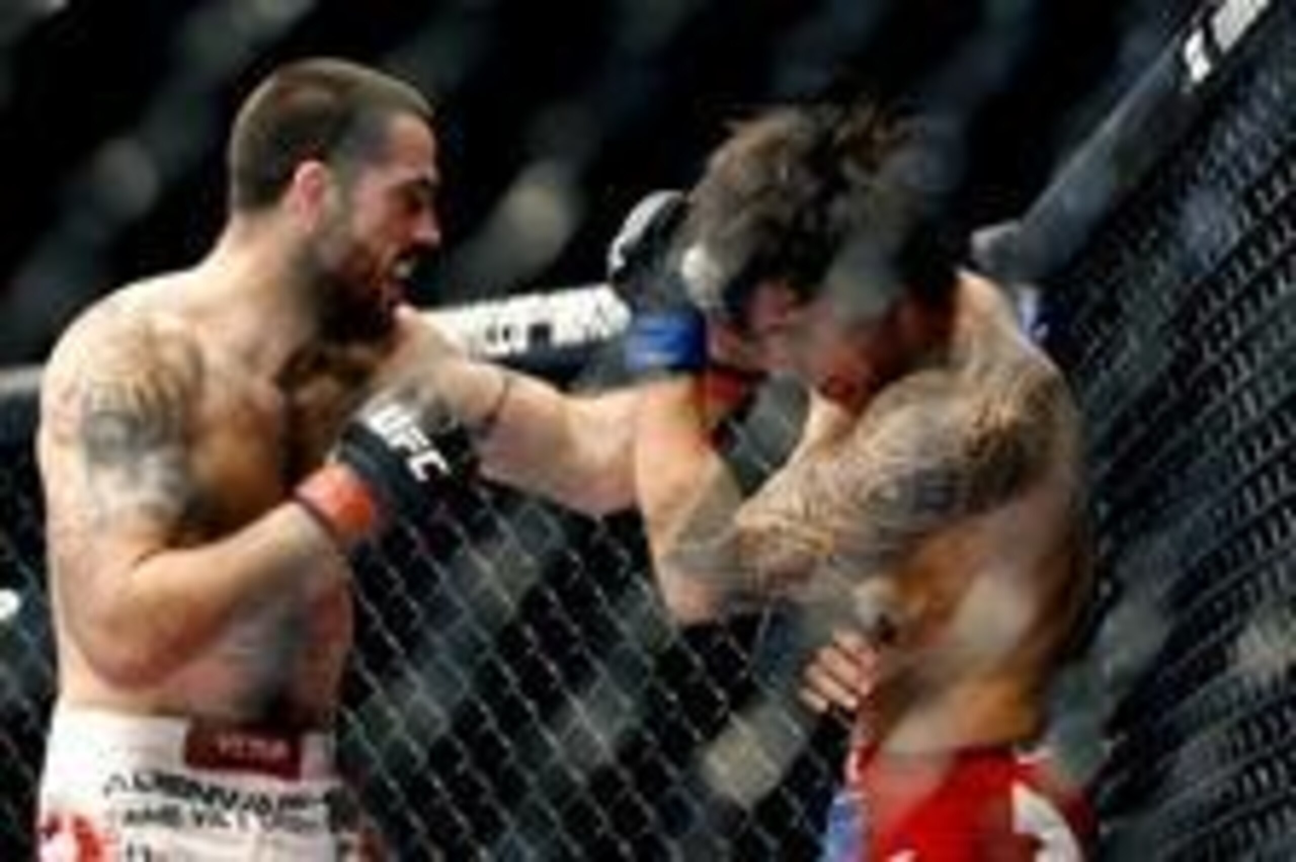 May 10, 2014; Cincinnati, OH, USA; Matt Brown (red gloves) fights Erick Silva (blue gloves) during a welterweight bout at US Bank Arena. Mandatory Credit: Joe Maiorana-USA TODAY Sports