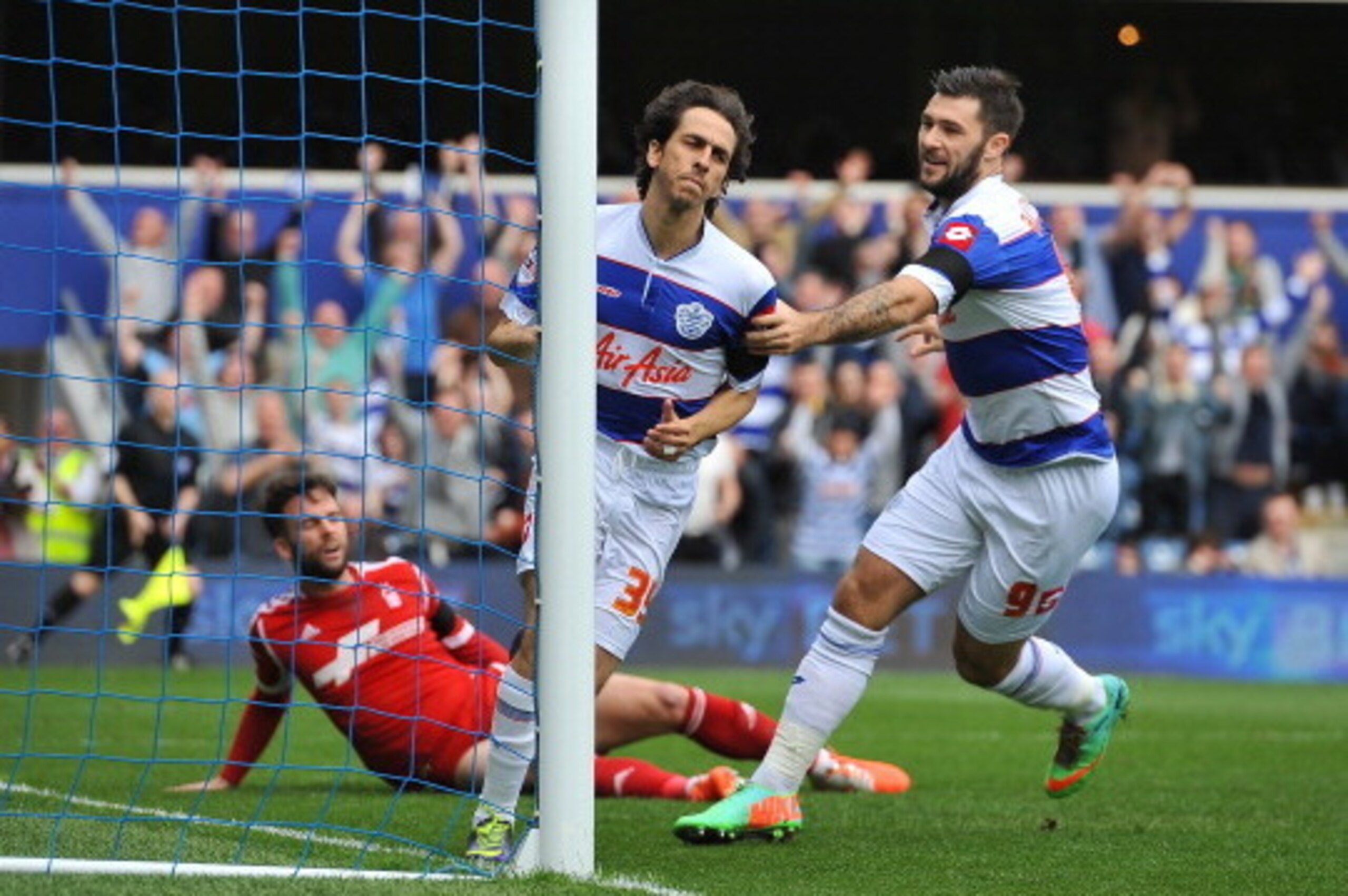 LONDON, ENGLAND - APRIL 12:  Yossi Benayoun of Queens Park Rangers celebrates scoring QPR's 1st goal with  Charlie Austin of Queens Park Rangers during the Sky Bet Championship match between Queens Park Rangers and Nottingham Forest at Loftus Road on Apri