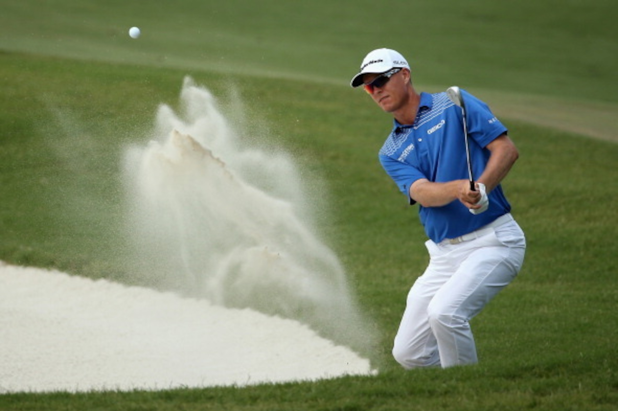 PONTE VEDRA BEACH, FL - MAY 10:  John Senden of Australia plays a bunker shot on the 11th hole during the third round of THE PLAYERS Championship on the stadium course at TPC Sawgrass on May 10, 2014 in Ponte Vedra Beach, Florida.  (Photo by Richard Heath