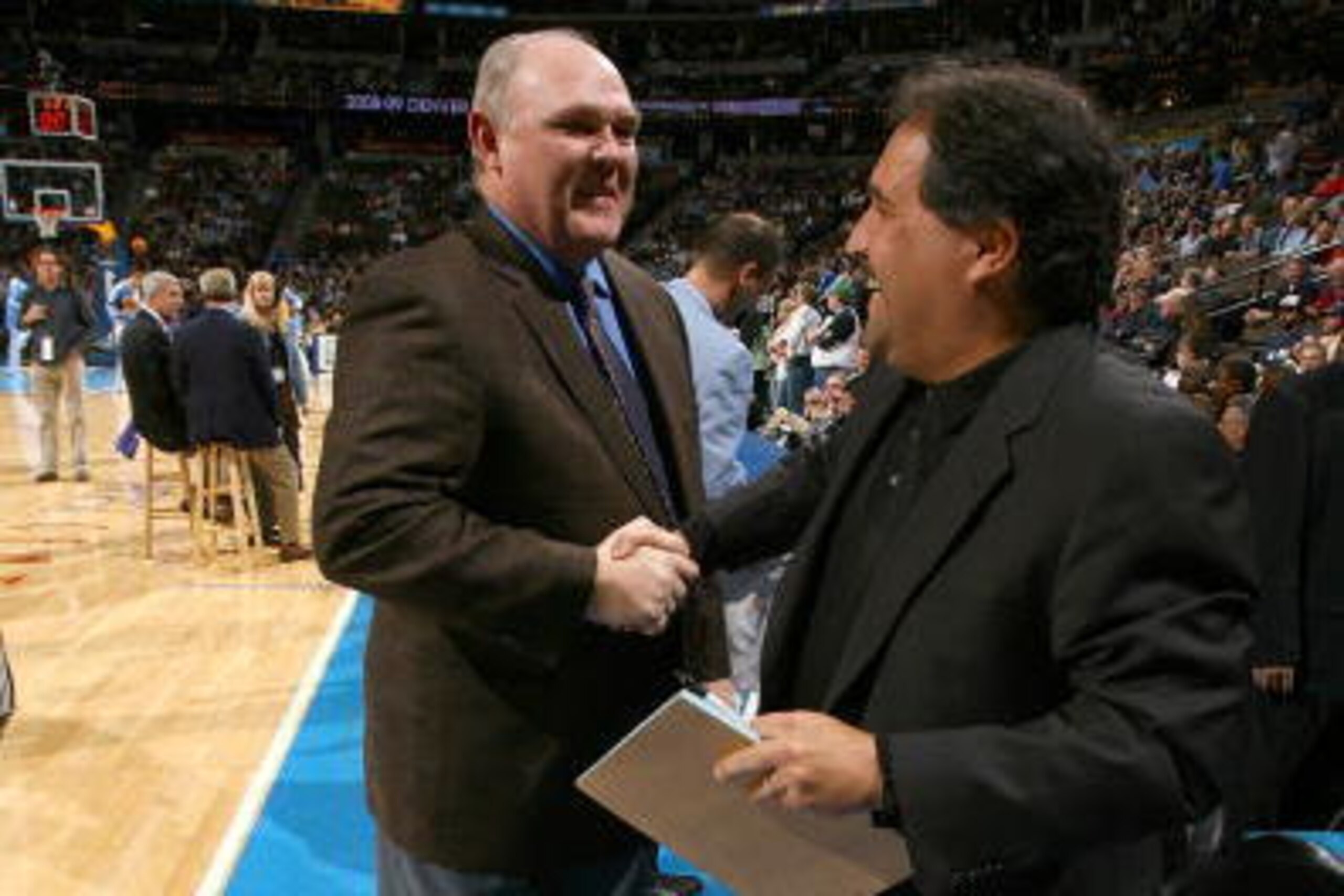 DENVER - JANUARY 17:  Head coaches George Karl of the the Denver Nuggets and Stan Van Gundy of the Orlando Magic shake hands prior to the game on January 17, 2009 at the Pepsi Center in Denver, Colorado. The Magic won 106-88. NOTE TO USER: User expressly 