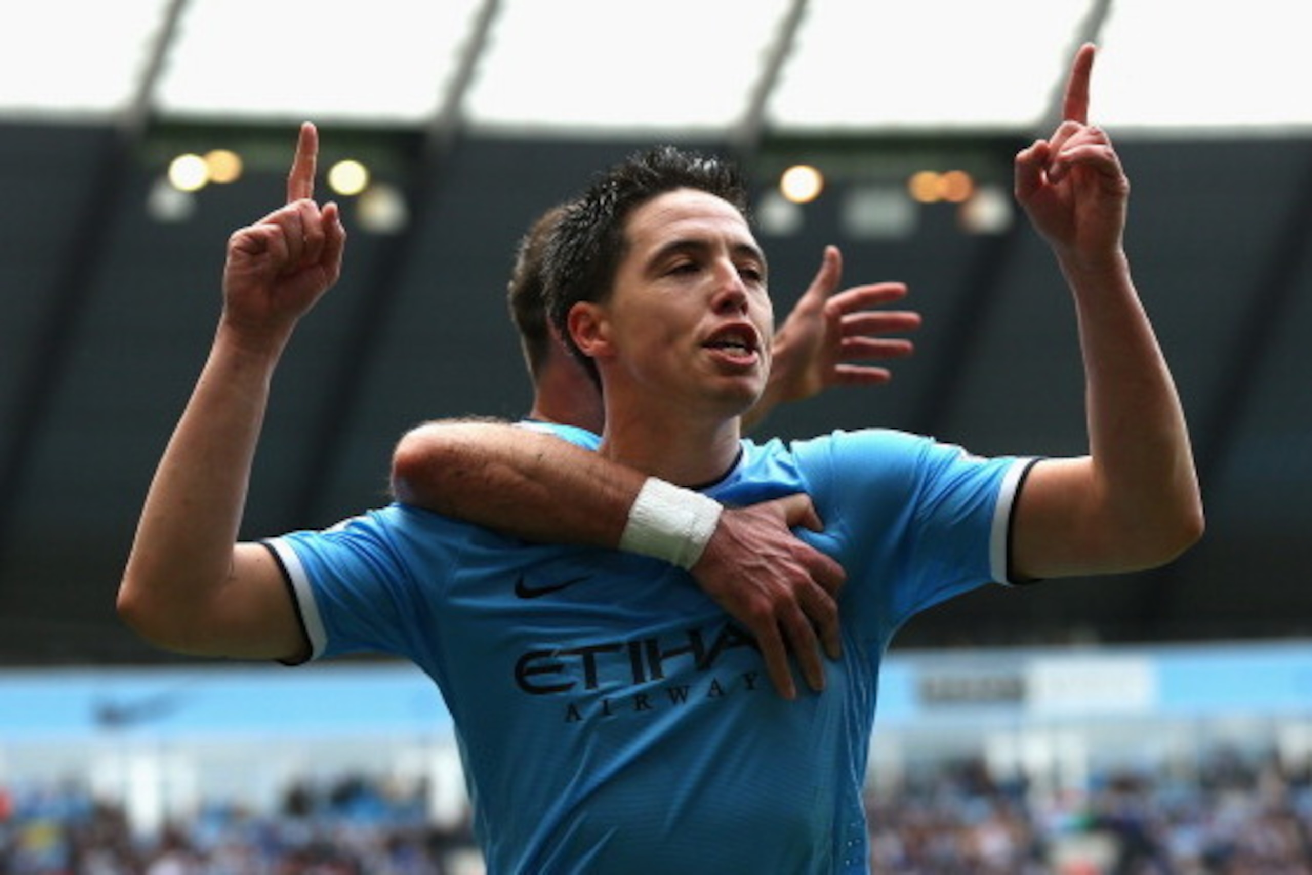 MANCHESTER, ENGLAND - MAY 11:  Samir Nasri of Manchester City celebrates scoring the first goal during the Barclays Premier League match between Manchester City and West Ham United at the Etihad Stadium on May 11, 2014 in Manchester, England.  (Photo by A