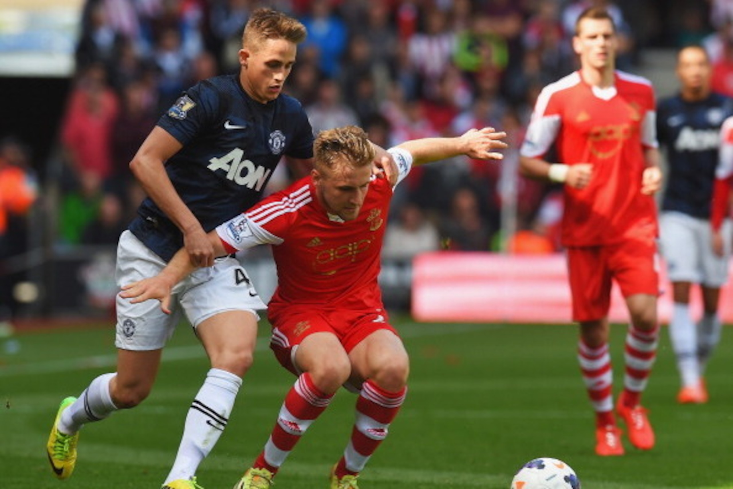 SOUTHAMPTON, ENGLAND - MAY 11:  (L-R) Adnan Januzaj of Manchester United and Luke Shaw of Southampton challenge for the ball during the Barclays Premier League match between Southampton and Manchester United at St Mary's Stadium on May 11, 2014 in Southam