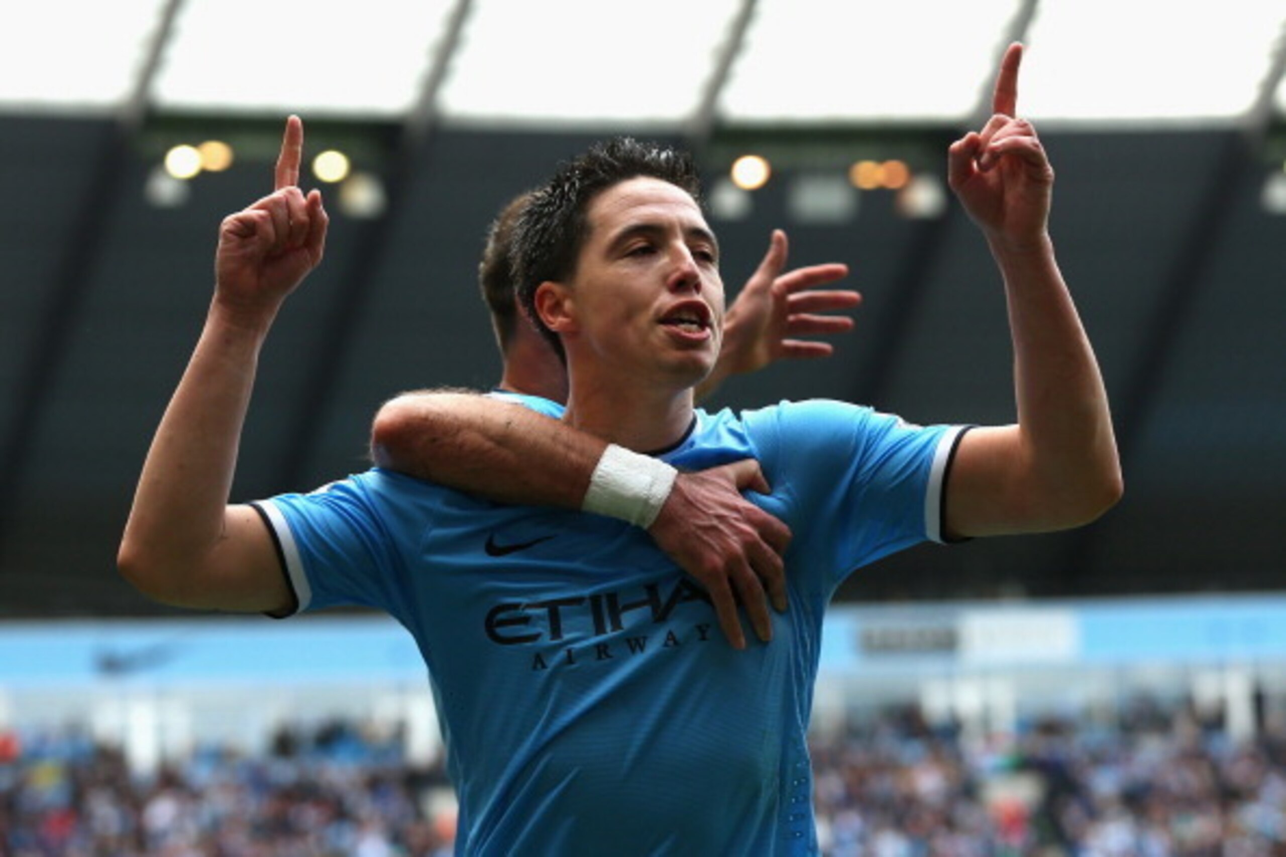 MANCHESTER, ENGLAND - MAY 11:  Samir Nasri of Manchester City celebrates scoring the first goal during the Barclays Premier League match between Manchester City and West Ham United at the Etihad Stadium on May 11, 2014 in Manchester, England.  (Photo by A