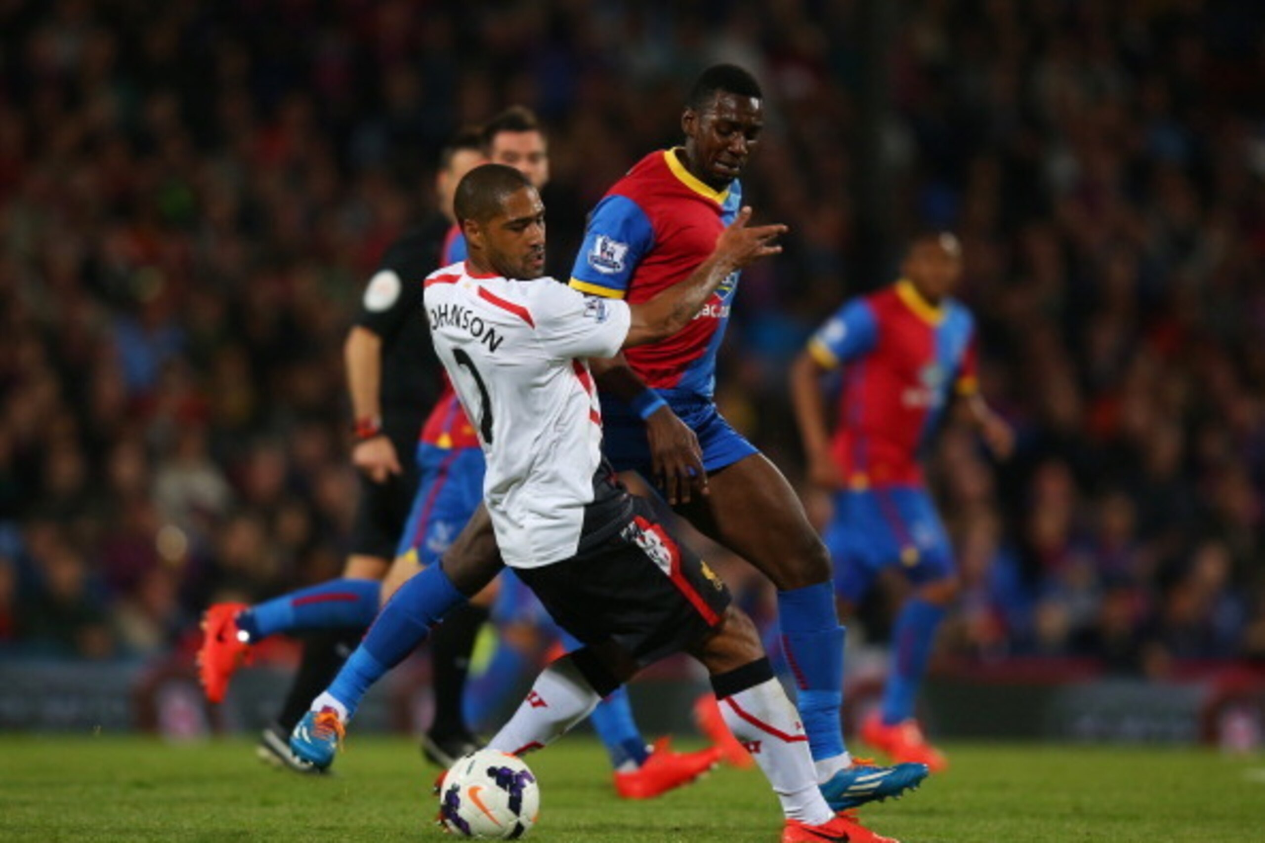 LONDON, ENGLAND - MAY 05:  Glen Johnson of Liverpool and Yannick Bolasie of Crystal Palace compete for the ball during the Barclays Premier League match between Crystal Palace and Liverpool at Selhurst Park on May 5, 2014 in London, England.  (Photo by Cl