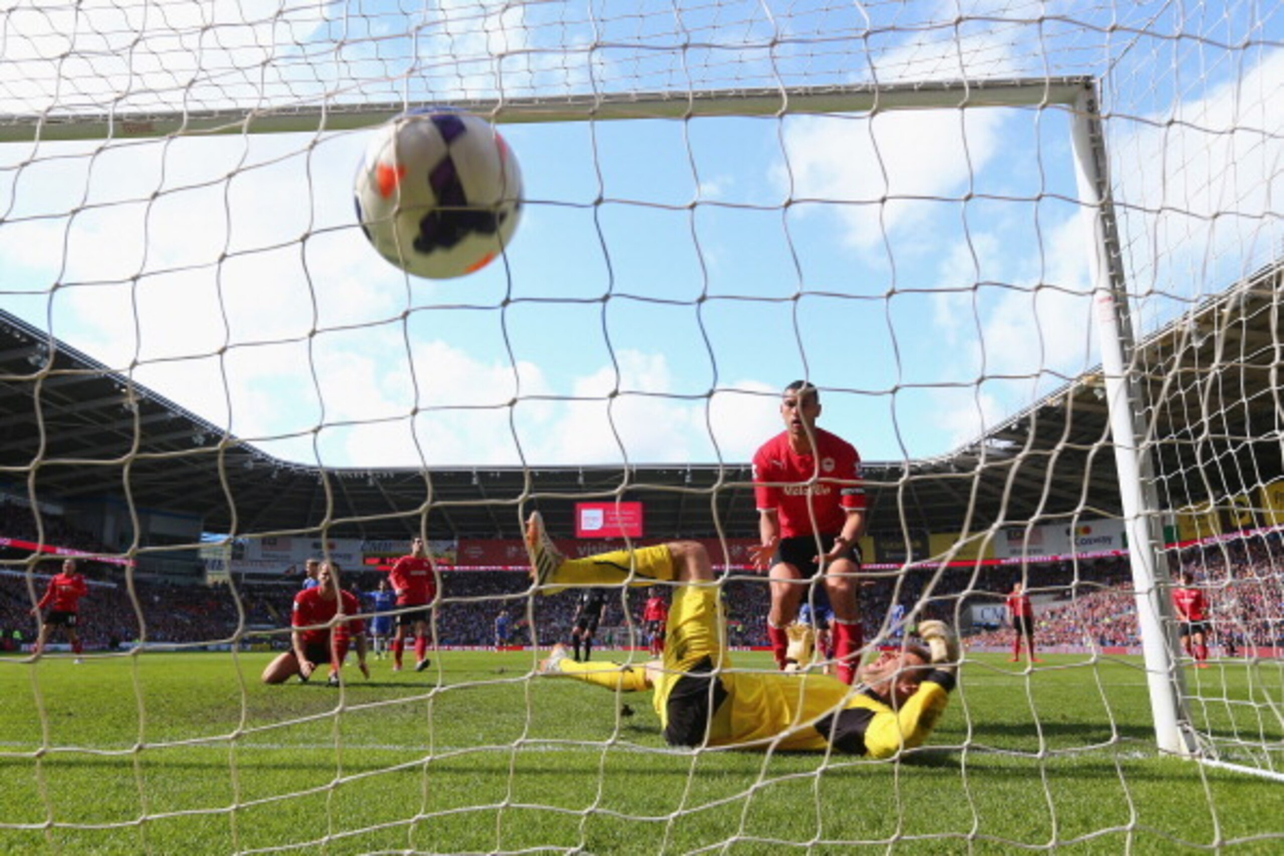 CARDIFF, WALES - MAY 11:  David Marshall the goalkeeper of Cardiff City is left grounded  after Andre Schurrle of Chelsea scores the equalising goal during the Barclays Premier League match between Cardiff City and Chelsea at Cardiff City Stadium on May 1