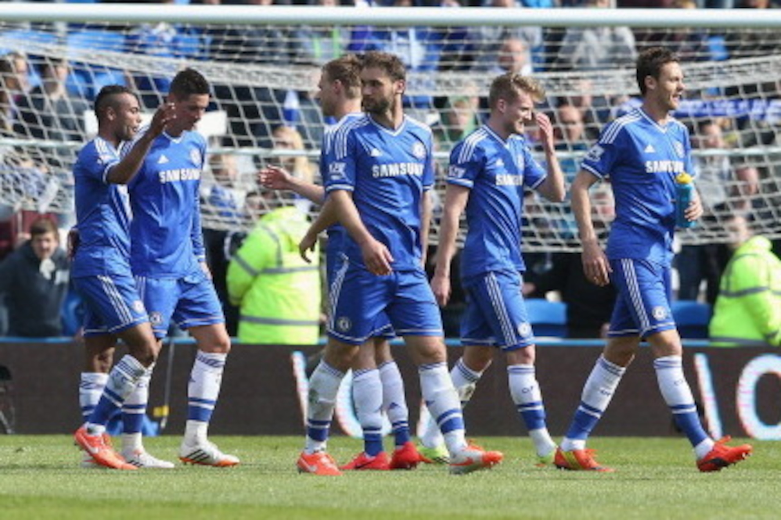 CARDIFF, WALES - MAY 11: Ashley Cole of Chelsea is congratulated by team mates as he leaves the field after their victory during the Barclays Premier League match between Cardiff City and Chelsea at the Cardiff City Stadium on May 11, 2014 in Cardiff, Wal