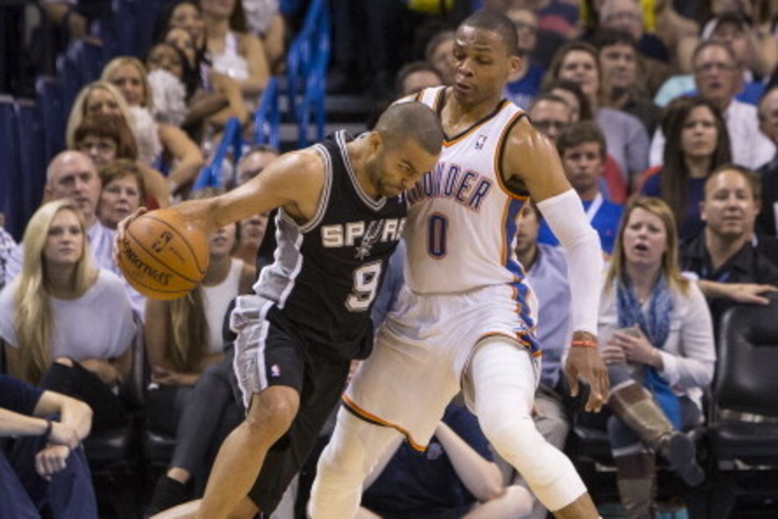 OKLAHOMA CITY, OK - April 3, 2014: Tony Parker #9 of the San Antonio Spurs drives against Russell Westbrook #0 of the Oklahoma City Thunder at the Chesapeake Arena on April 3, 2014 in Oklahoma City, Oklahoma. NOTE TO USER:  User expressly acknowledges and