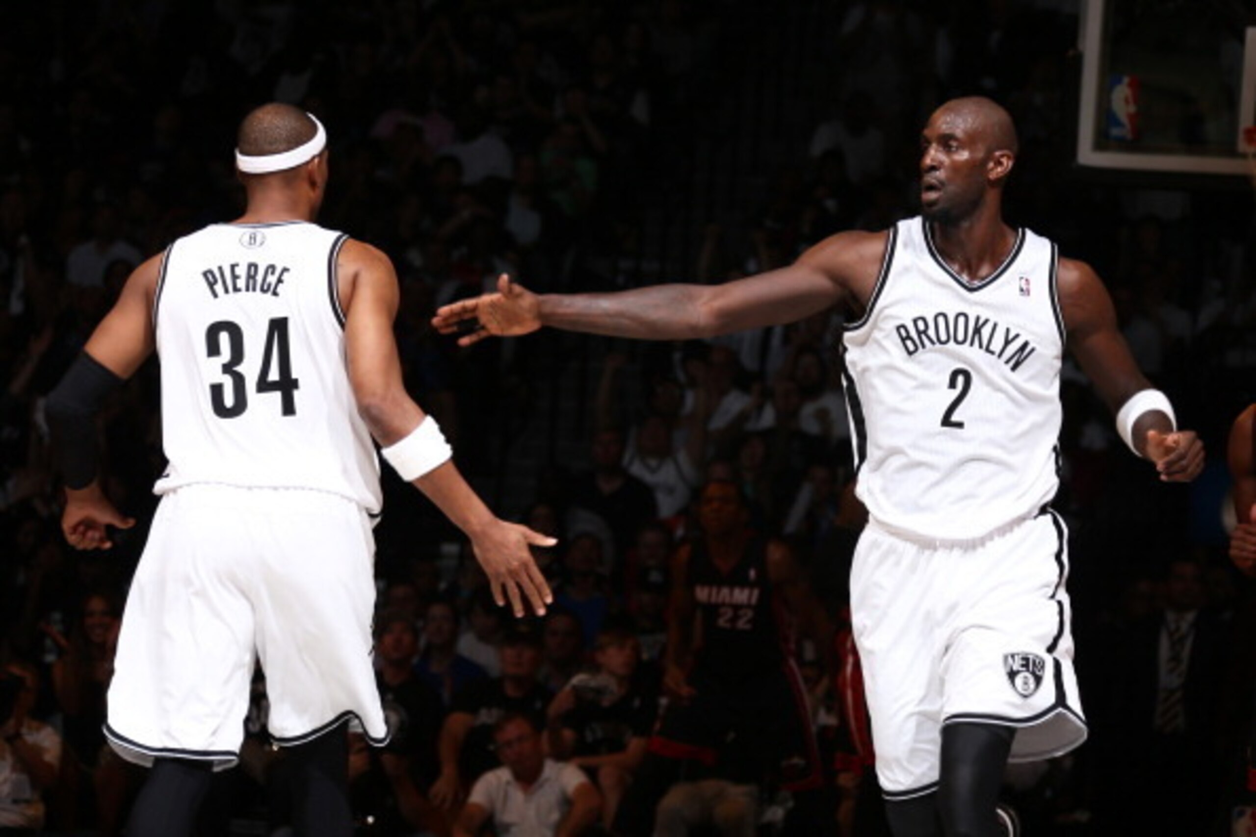 BROOKLYN, NY - MAY 10: Paul Pierce #34 and Kevin Garnett #2 of the Brooklyn Nets slap hands during a game against the Miami Heat during Game Three of the Eastern Conference Semifinals on May 10, 2014 at Barclays Center in Brooklyn. NOTE TO USER: User expr