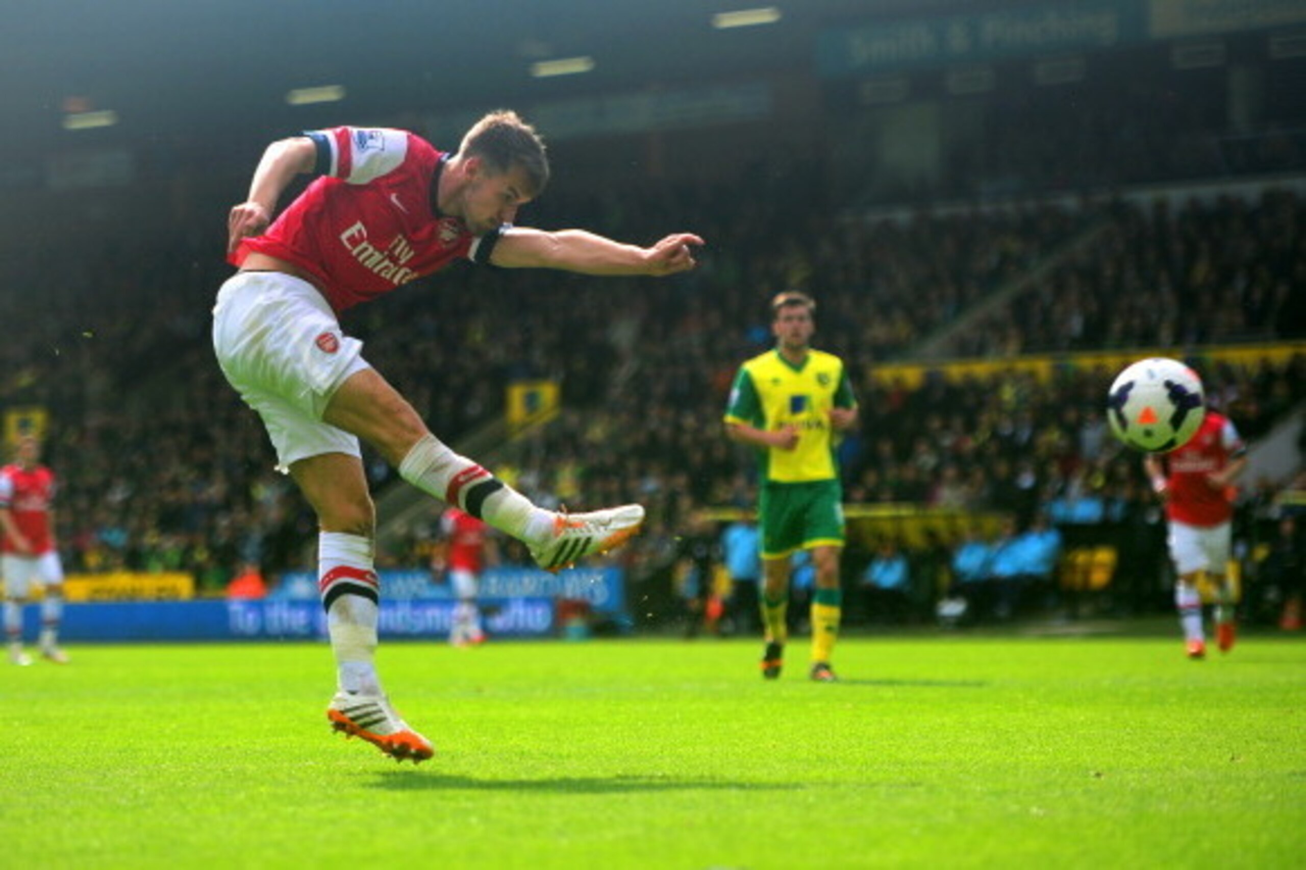 NORWICH, ENGLAND - MAY 11: Aaron Ramsey of Arsenal scores the opening goal during the Barclays Premier League match between Norwich City and Arsenal at Carrow Road on May 11, 2014 in Norwich, England. (Photo by Jamie McDonald/Getty Images) NORWICH, ENGLAND - MAY 11: Aaron Ramsey of Arsenal scores the opening goal during the Barclays Premier League match between Norwich City and Arsenal at Carrow Road on May 11, 2014 in Norwich, England. (Photo by Jamie McDonald/Getty Images)