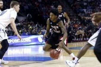 Mar 21, 2014; San Antonio, TX, USA; Louisiana Lafayette Ragin Cajuns guard Elfrid Payton (2) drives against Creighton Bluejays guard Grant Gibbs (10) in the first half of a men's college basketball game during the second round of the 2014 NCAA Tournament 