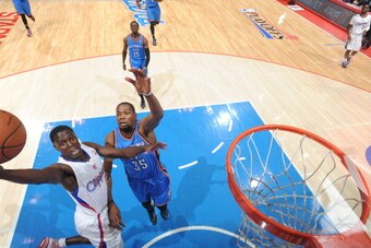 LOS ANGELES, CA - MAY 11: Darren Collison #2 of the Los Angeles Clippers shoots against Kevin Durant #35 of the Oklahoma City Thunder in Game Four of the Western Conference Semifinals during the 2014 NBA Playoffs at Staples Center on May 11, 2014 in Los A