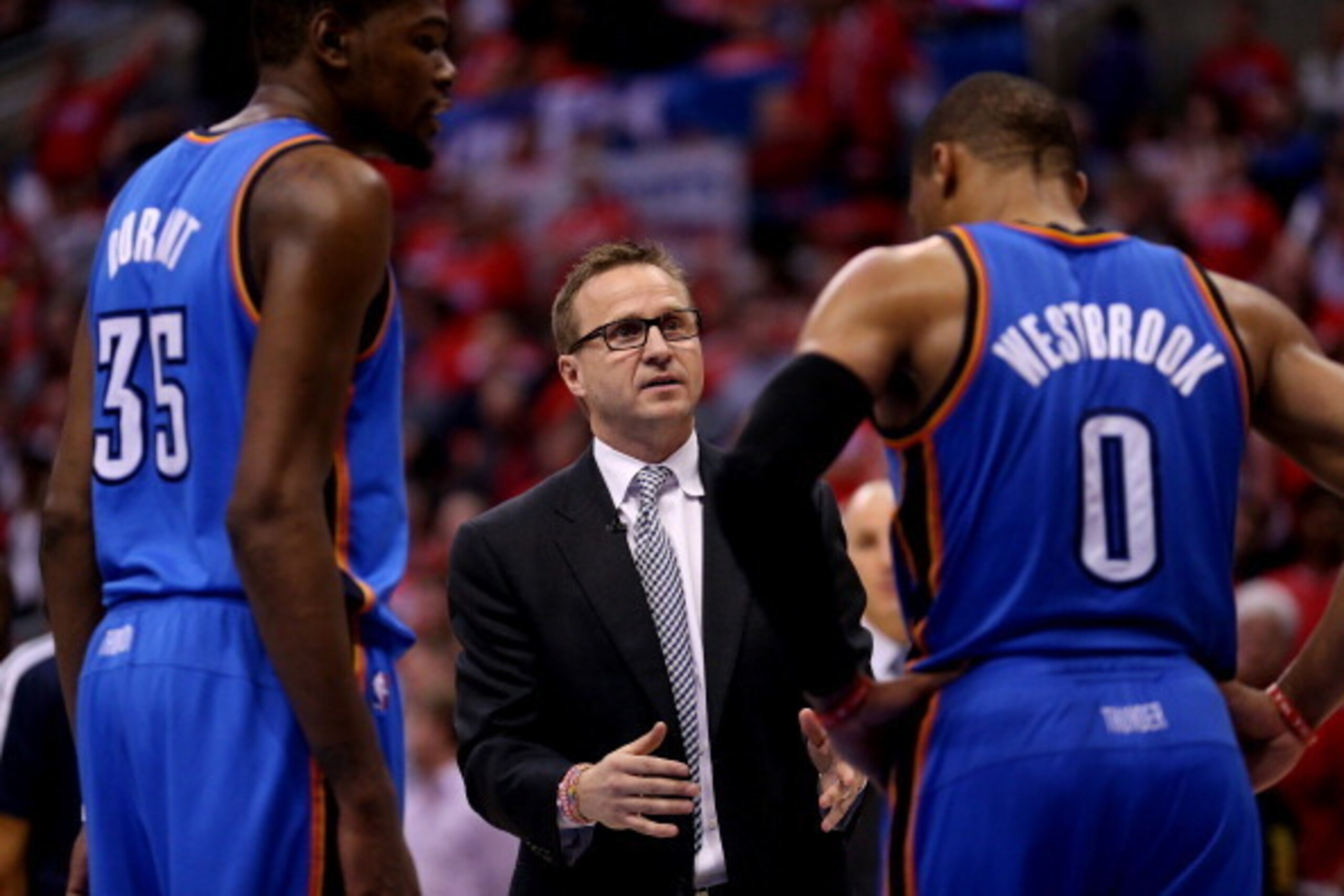 LOS ANGELES, CA - MAY 09:  Head coach Scott Brooks of the Oklahoma City Thunder talks with Russell Westbrook #0 and Kevin Durant #35 against  the Los Angeles Clippers in Game Three of the Western Conference Semifinals during the 2014 NBA Playoffs at Stapl