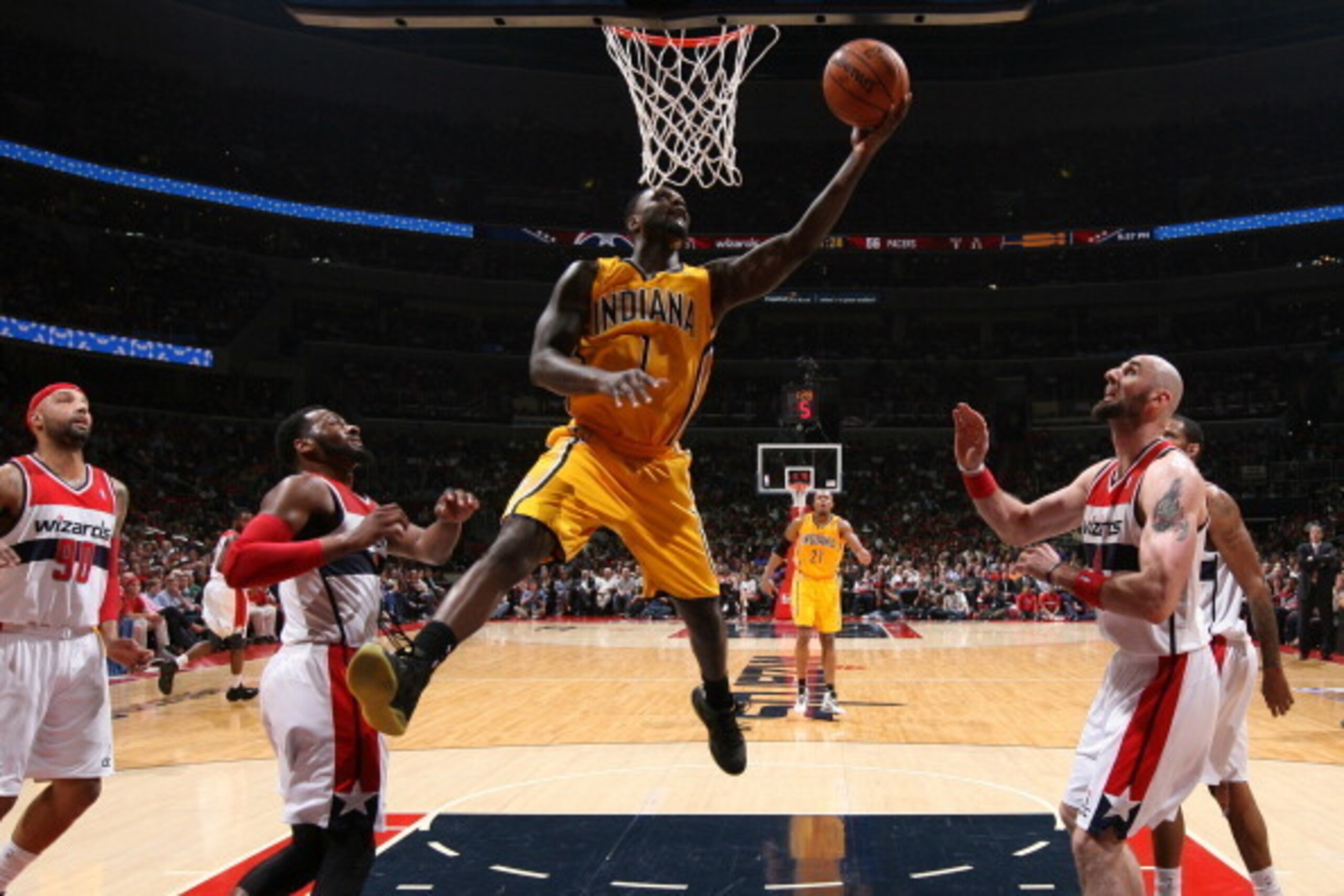 WASHINGTON, DC - MAY 9: Lance Stephenson #1 of the Indiana Pacers shoots against John Wall #2 and Marcin Gortat #4 of the Washington Wizards in Game Three of the Eastern Conference Semifinals during the 2014 NBA Playoffs at the Verizon Center on May 9, 20 WASHINGTON, DC - MAY 9: Lance Stephenson #1 of the Indiana Pacers shoots against John Wall #2 and Marcin Gortat #4 of the Washington Wizards in Game Three of the Eastern Conference Semifinals during the 2014 NBA Playoffs at the Verizon Center on May 9, 20