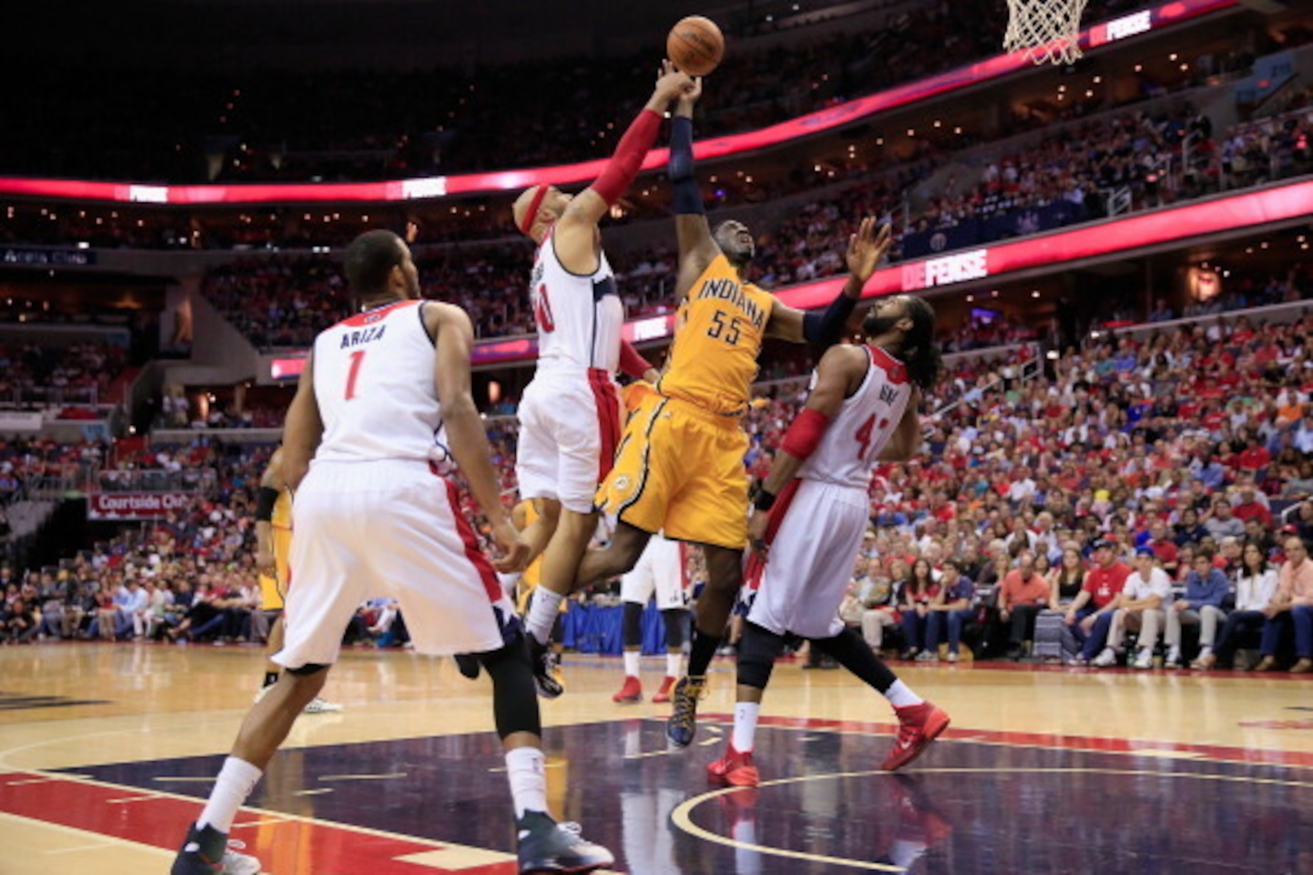 WASHINGTON, DC - MAY 11: Drew Gooden #90 of the Washington Wizards blocks a shot by Roy Hibbert #55 of the Indiana Pacers as Nene Hilario #42 of the Washington Wizards looks on during the first half of Game Four of the Eastern Conference Semifinals during WASHINGTON, DC - MAY 11: Drew Gooden #90 of the Washington Wizards blocks a shot by Roy Hibbert #55 of the Indiana Pacers as Nene Hilario #42 of the Washington Wizards looks on during the first half of Game Four of the Eastern Conference Semifinals during