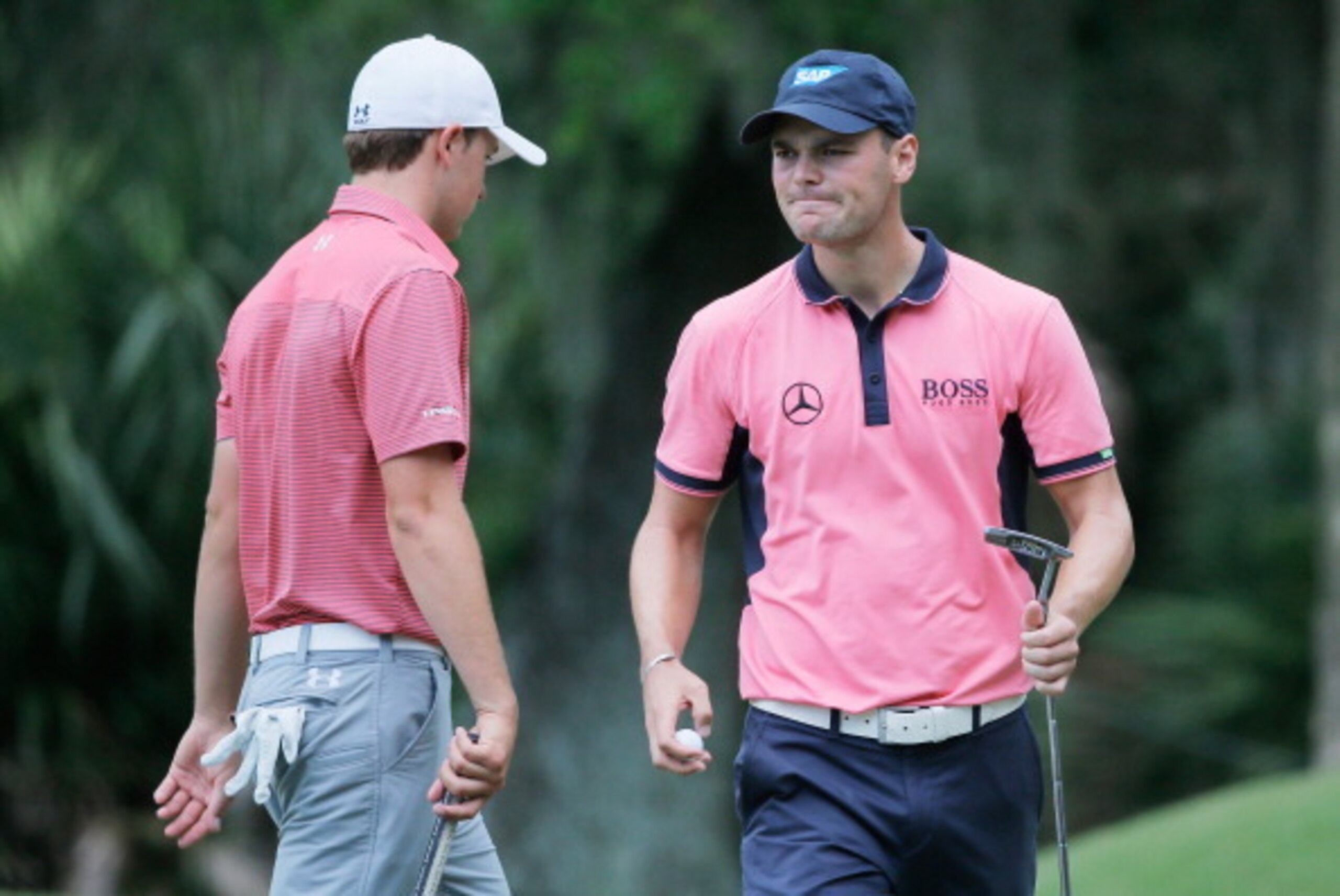 PONTE VEDRA BEACH, FL - MAY 11:  Martin Kaymer of Germany and Jordan Spieth of the United States wait on the tenth green during the final round of THE PLAYERS Championship on The Stadium Course at TPC Sawgrass on May 11, 2014 in Ponte Vedra Beach, Florida