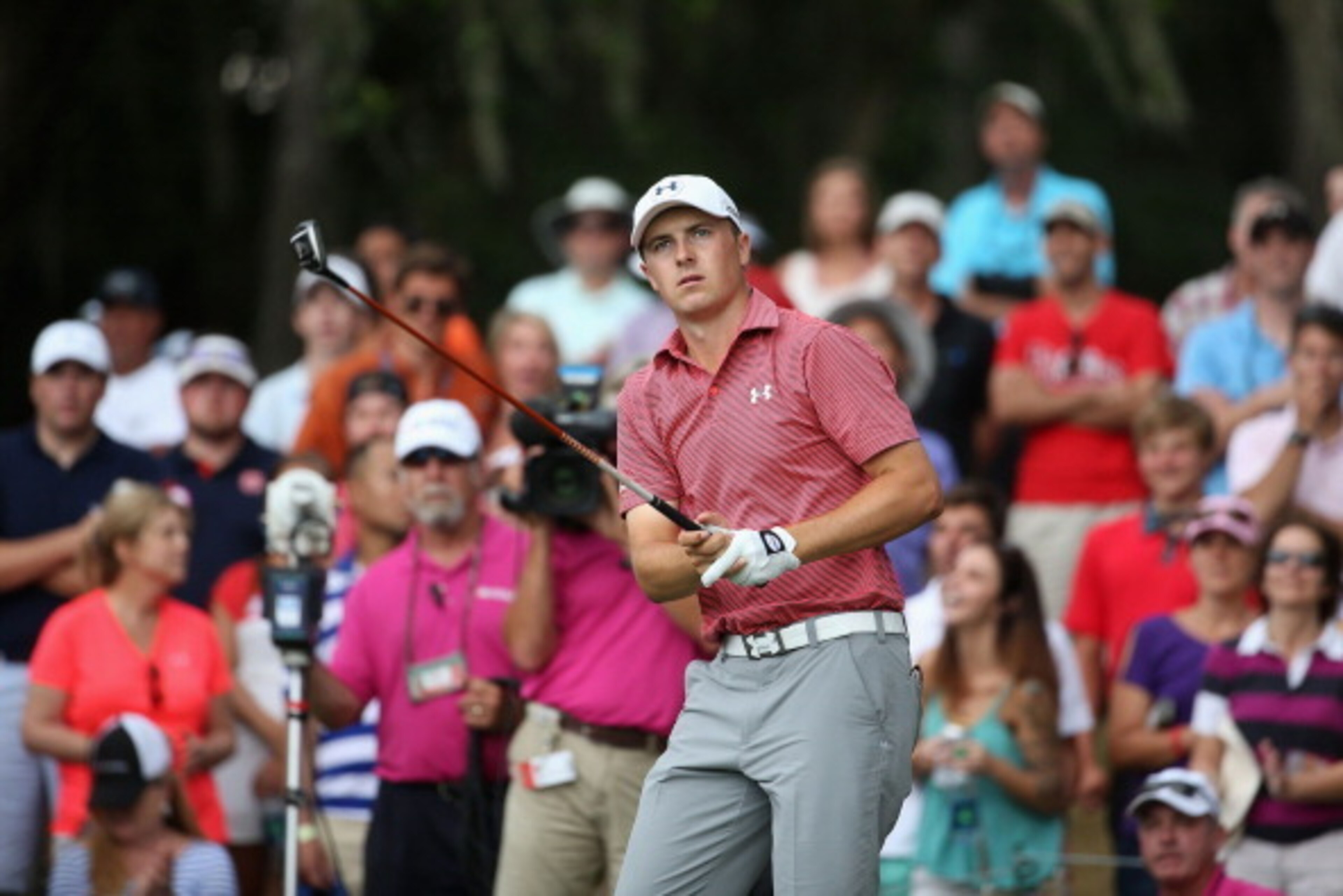 PONTE VEDRA BEACH, FL - MAY 11:  Jordan Spieth of the United States watches his tee shot on the 12th hole during the final round of THE PLAYERS Championship on The Stadium Course at TPC Sawgrass on May 11, 2014 in Ponte Vedra Beach, Florida.  (Photo by Ri
