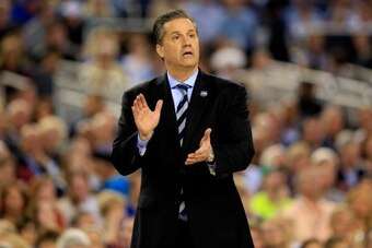 ARLINGTON, TX - APRIL 07:  Head coach John Calipari of the Kentucky Wildcats motions to his players during the NCAA Men's Final Four Championship against the Connecticut Huskies at AT&T Stadium on April 7, 2014 in Arlington, Texas.  (Photo by Jamie Squire
