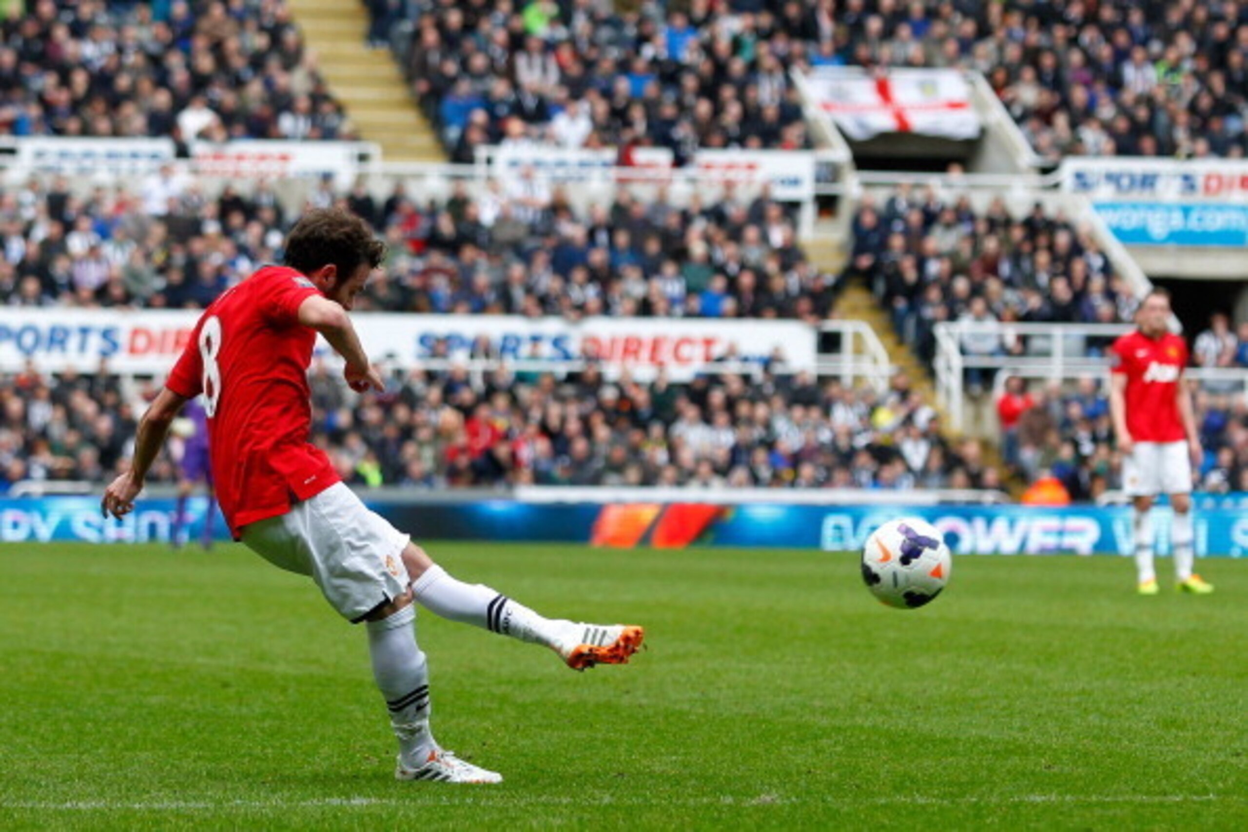 NEWCASTLE-UPON-TYNE, ENGLAND - APRIL 05: Juan Mata of Manchester United scores his sides first goal during the Barclays Premier League match between Newcastle United and Manchester United at St James' Park on April 5, 2014 in Newcastle-Upon-Tyne, England.
