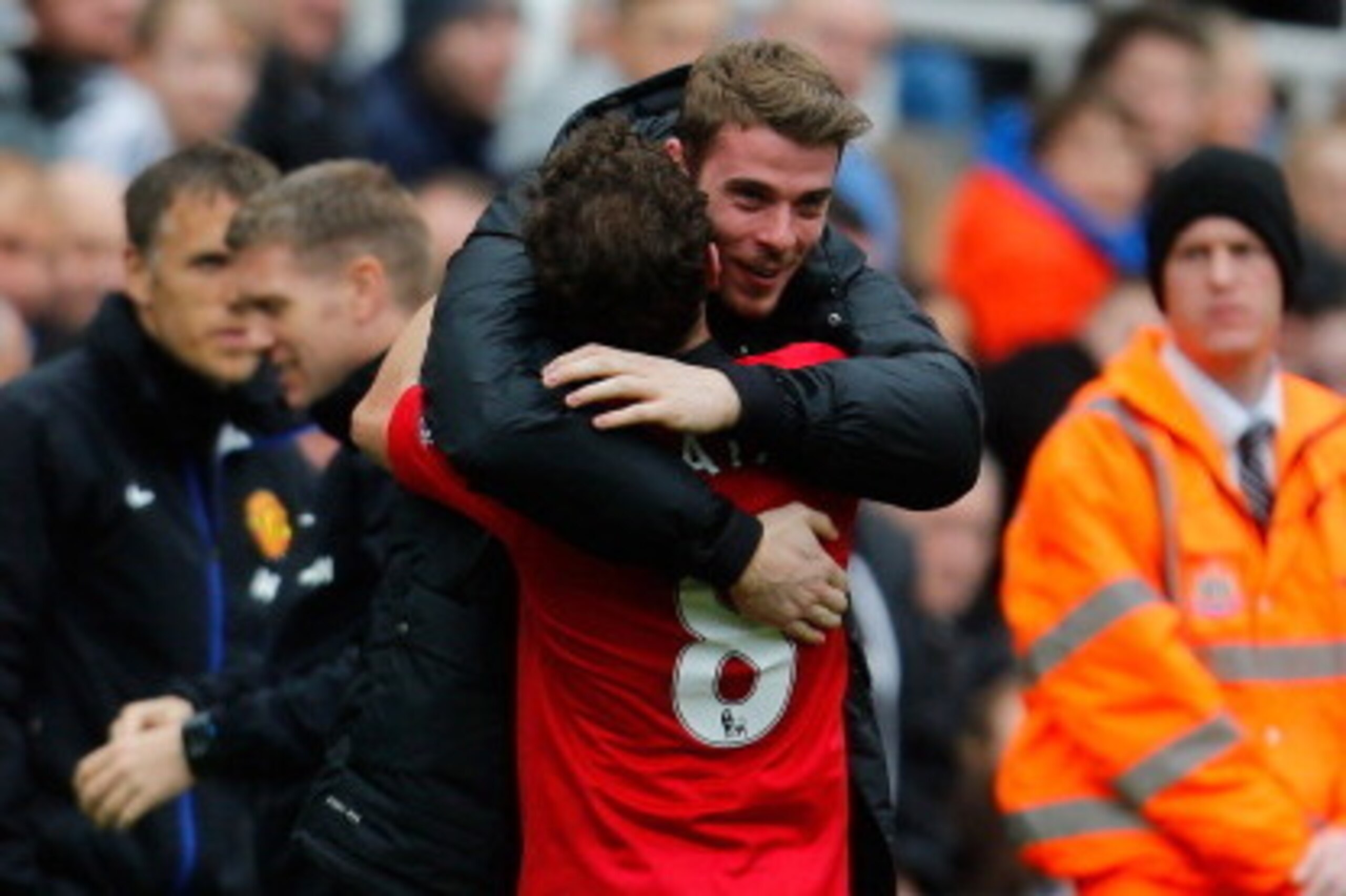 NEWCASTLE UPON TYNE, ENGLAND - APRIL 05: Juan Mata of Manchester United celebrates his first goal with team mate David De Gea (R) during the Barclays Premier League match between Newcastle United and Manchester United at St James' Park on April 5, 2014 in