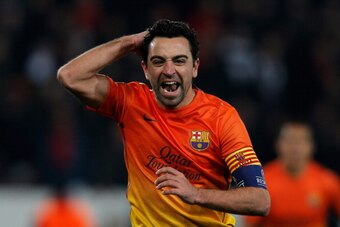 PARIS, FRANCE - APRIL 02:  Xavi of Barcelona celebrates scoring a penalty for his teams second goal during the UEFA Champions League Quarter Final match between Paris Saint-Germain and Barcelona FCB at Parc des Princes on April 2, 2013 in Paris, France.  