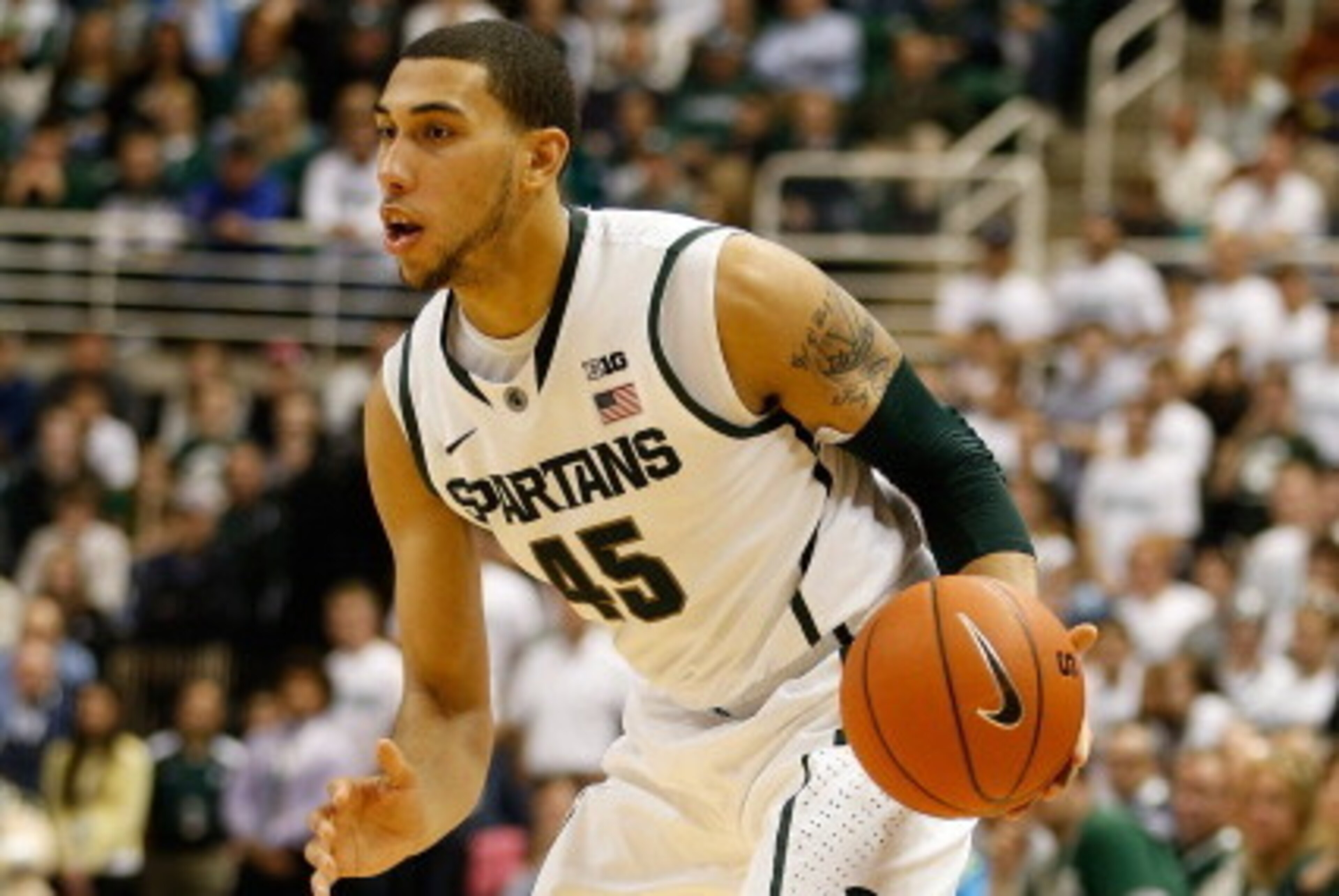 EAST LANSING, MI - NOVEMBER 20: Denzel Valentine #45 of the Michigan State Spartans dribbles the ball while playing the Boise State Broncos at the Breslin Center on November 20, 2012 in East Lansing, Michigan. (Photo by Gregory Shamus/Getty Images)