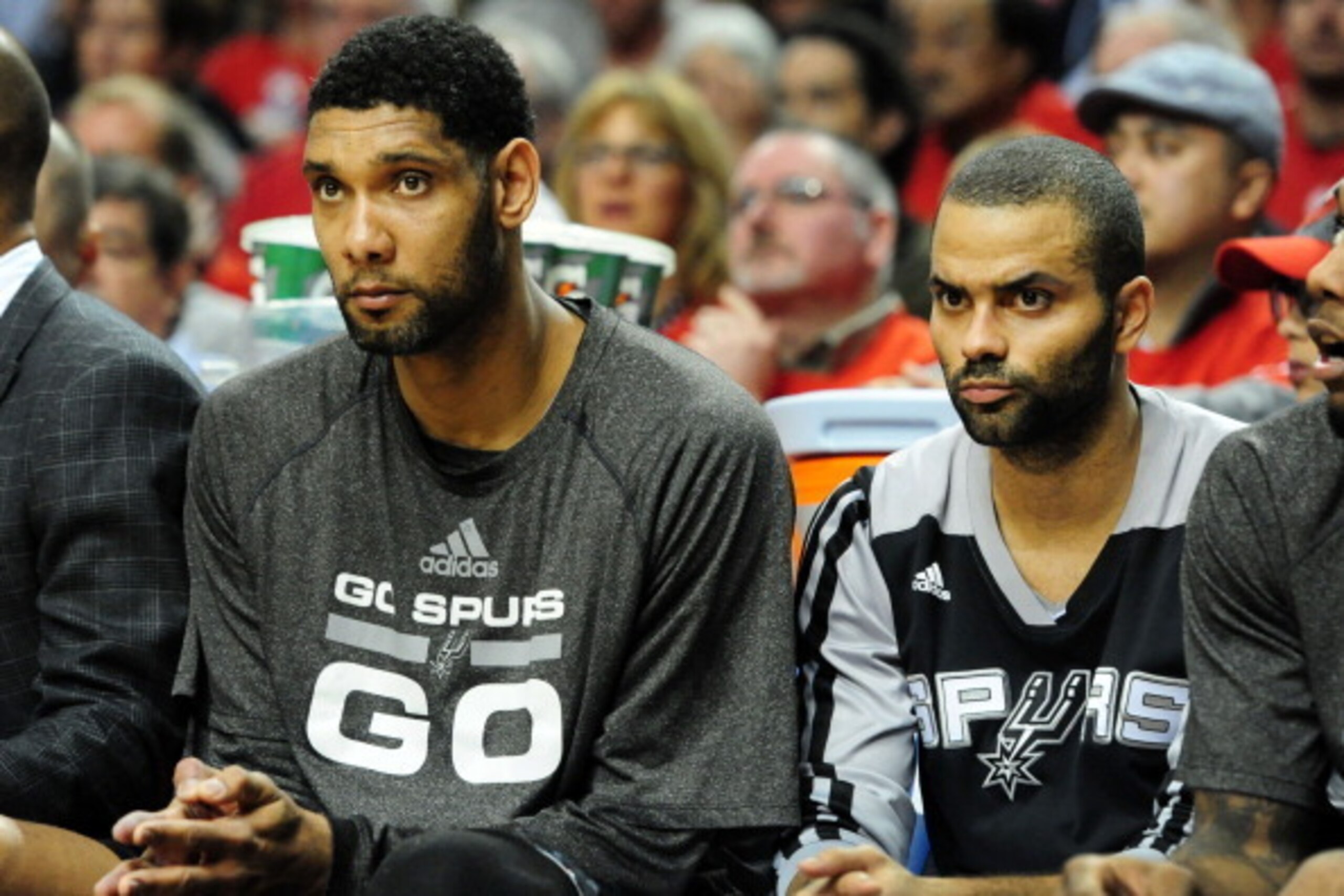 PORTLAND, OR - MAY 10: Tim Duncan #21 and Tony Parker #9 of the San Antonio Spurs look on from the bench in the first quarter of Game Three of the Western Conference Semifinals against the Portland Trail Blazers to start during the 2014 NBA Playoffs at th