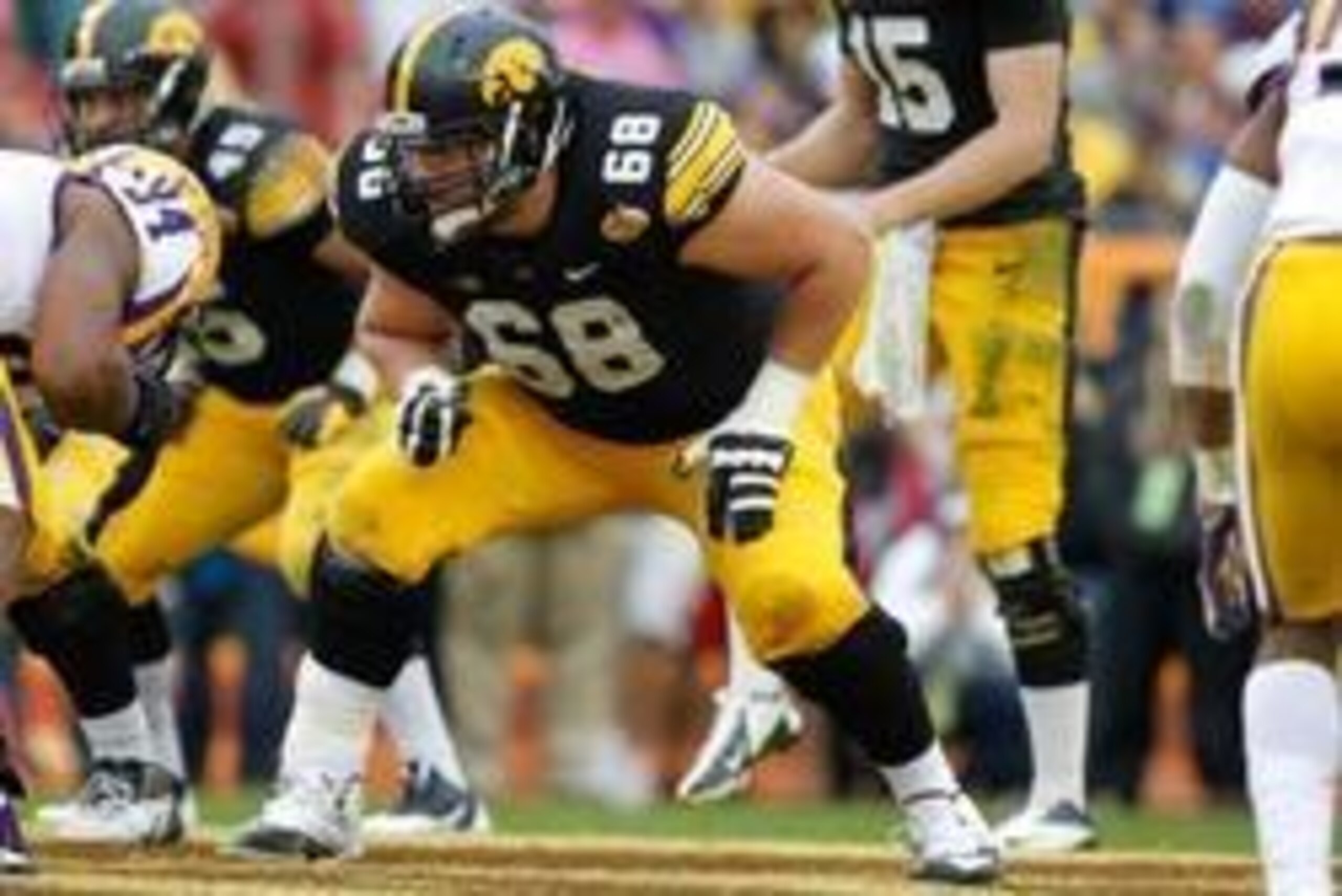Jan 1, 2014; Tampa, Fl, USA; Iowa Hawkeyes offensive linesman Brandon Scherff (68) blocks against the LSU Tigers during the first half at Raymond James Stadium. Mandatory Credit: Kim Klement-USA TODAY Sports