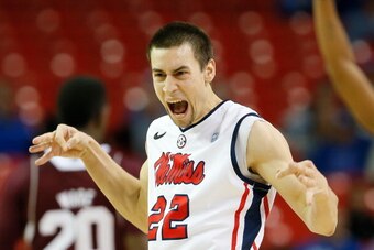 ATLANTA, GA - MARCH 13:  Marshall Henderson #22 of the Mississippi Rebels reacts after hitting a three-point basket against the Mississippi State Bulldogs during the second round of the SEC Men's Basketball Tournament at Georgia Dome on March 13, 2014 in 