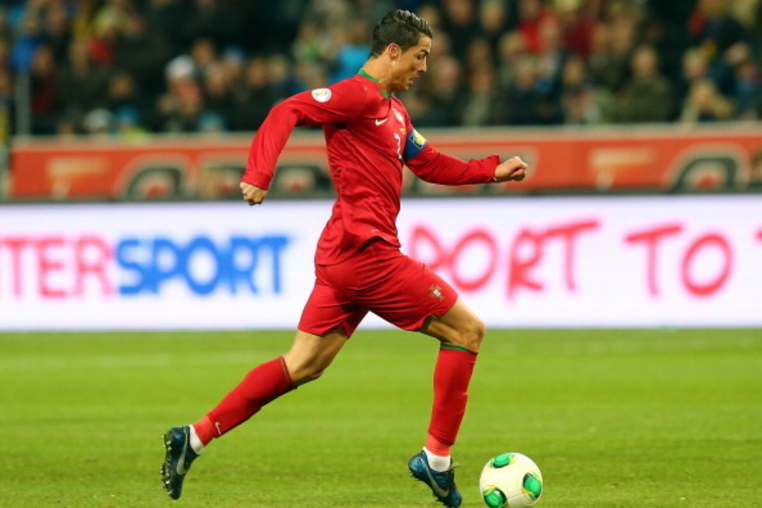STOCKHOLM, SWEDEN - NOVEMBER 19:  Cristiano Ronaldo of Portugal runs with the ball during the FIFA 2014 World Cup Qualifier Play-off Second Leg match between Sweden and Portugal at Friends Arena on November 19, 2013 in Stockholm, Sweden.  (Photo by Martin