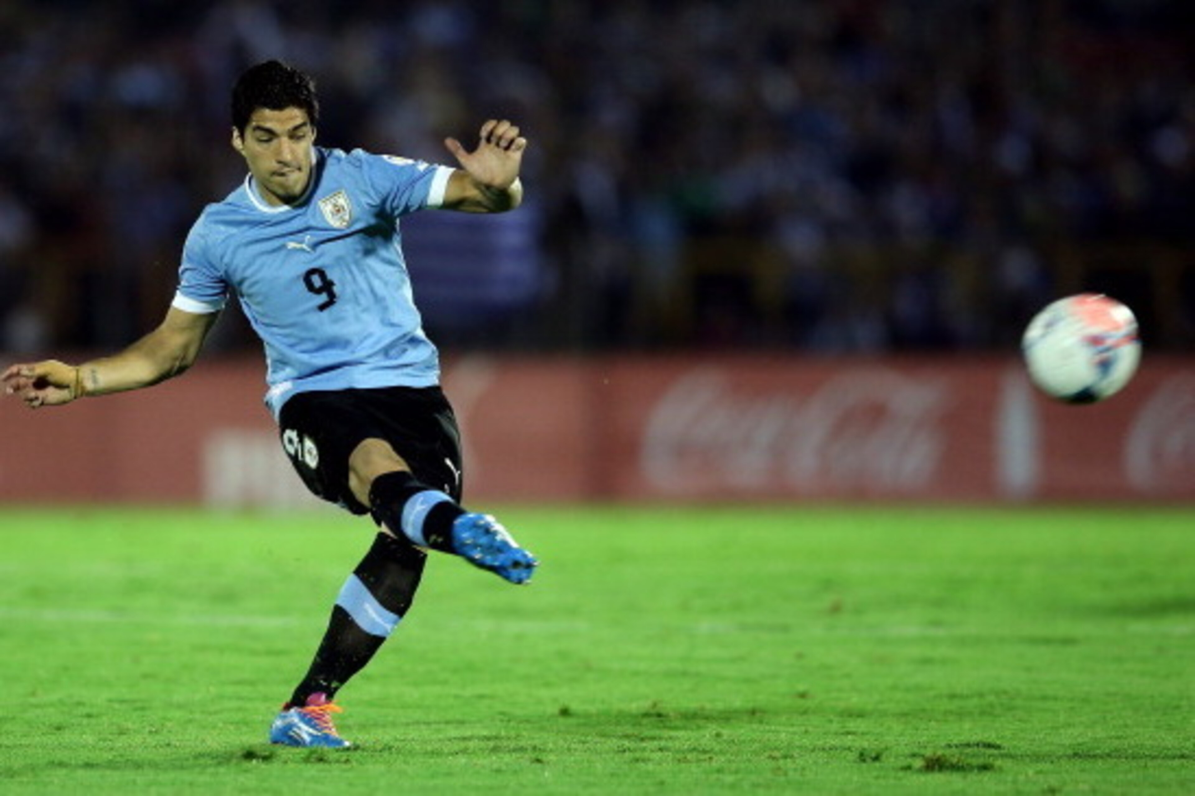 MONTEVIDEO, URUGUAY - NOVEMBER 20:  Luis Suarez of Uruguay runs with the ball during leg 2 of the FIFA World Cup Qualifier match between Uruguay and Jordan at Centenario Stadium Stadium on November 20, 2013 in Montevideo, Uruguay.  (Photo by Friedemann Vo