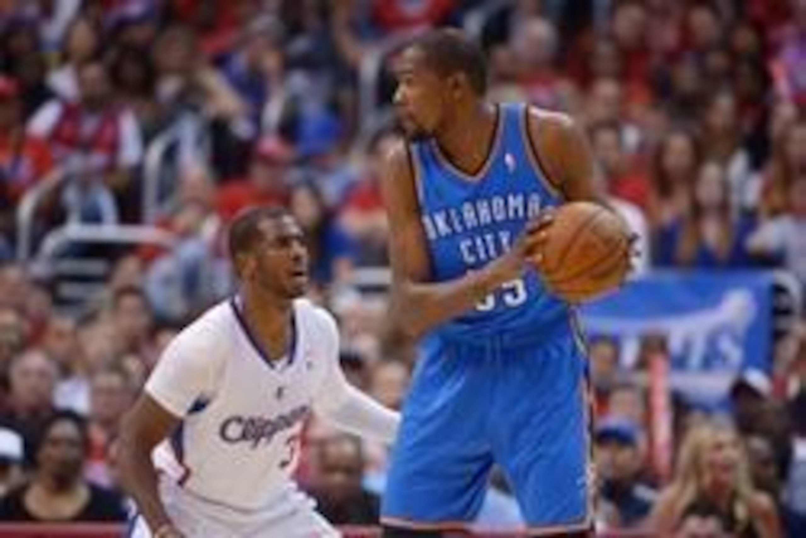 May 11, 2014; Los Angeles, CA, USA; Oklahoma City Thunder forward Kevin Durant (35) is defended by Los Angeles Clippers guard Chris Paul (3) in game four of the second round of the 2014 NBA Playoffs at Staples Center. The Clippers defeated the Thunder 101