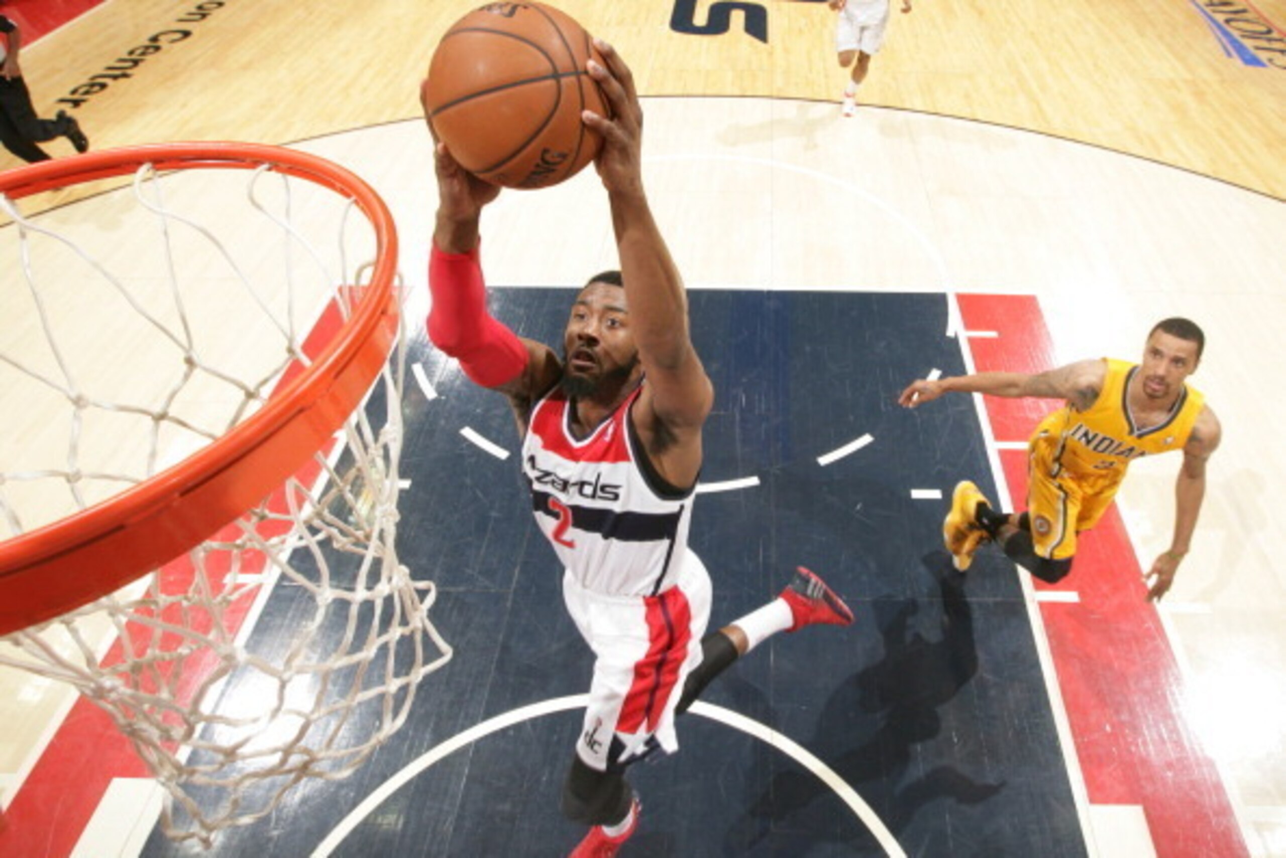 WASHINGTON, DC - MAY 11: John Wall #2 of the Washington Wizards dunks against the Indiana Pacers in Game Four of the Eastern Conference Semifinals during the 2014 NBA Playoffs at the Verizon Center on May 11, 2014 in Washington, DC. NOTE TO USER: User exp