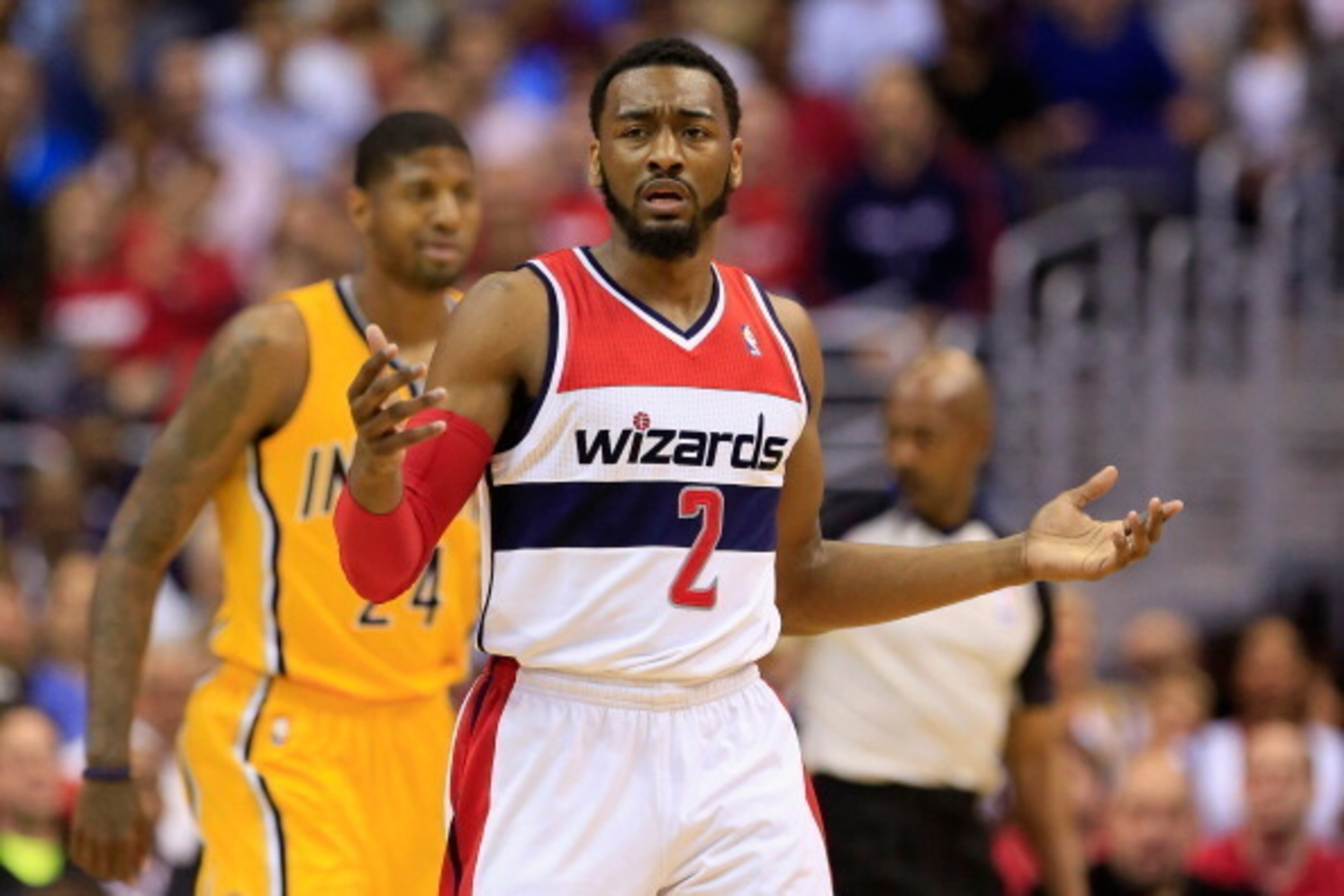 WASHINGTON, DC - MAY 09: John Wall #2 of the Washington Wizards reacts after being called for a foul against the Indiana Pacers during Game 3 of the Eastern Conference Semifinals during the 2014 NBA Playoffs at Verizon Center on May 9, 2014 in Washington,