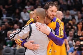 LOS ANGELES, CA - NOVEMBER 1: Pau Gasol #16 of the Los Angeles Lakers and Tony Parker #9 of the San Antonio Spurs hug before a game on November 1, 2013 at STAPLES Center in Los Angeles, California. NOTE TO USER: User expressly acknowledges and agrees that