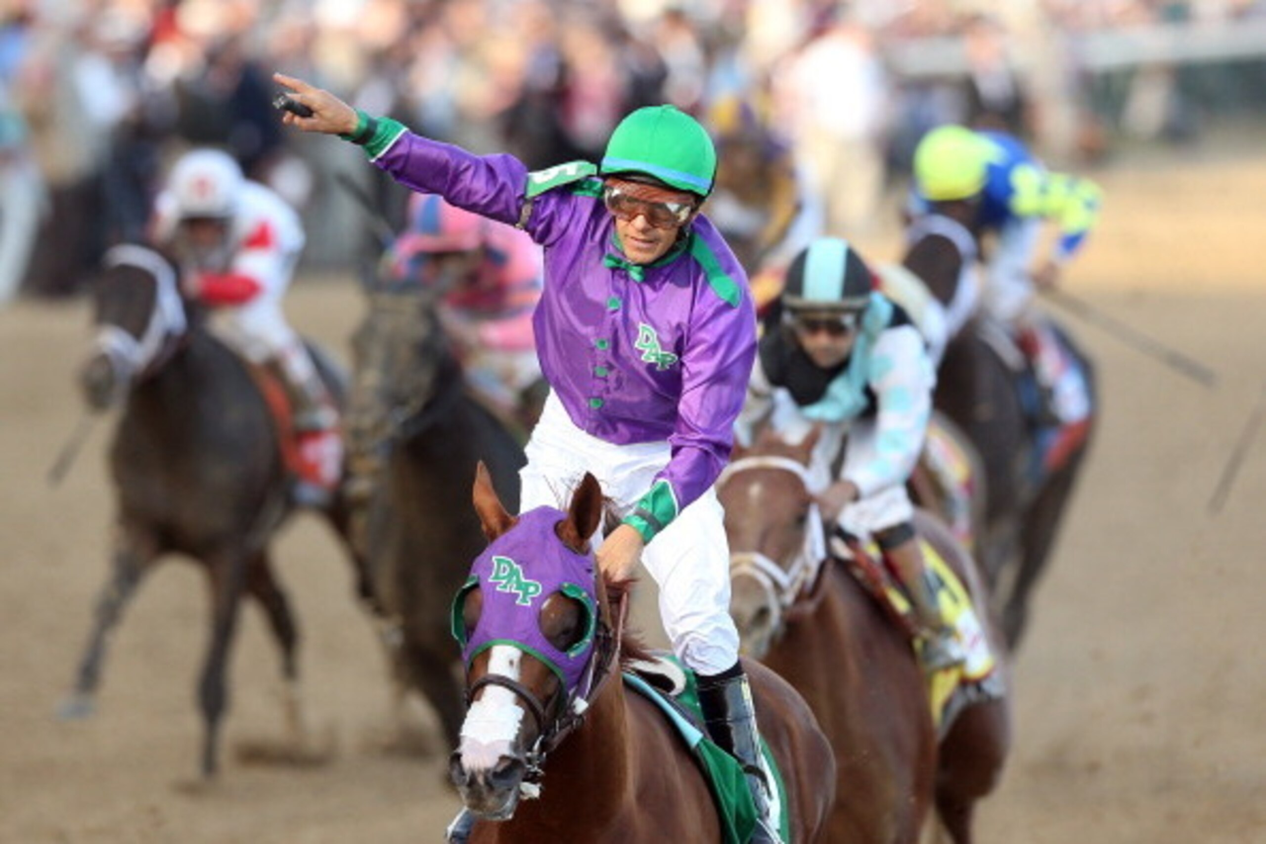 LOUISVILLE, KY - MAY 03:  Jockey Victor Espinoza celebrates atop of California Chrome #5 after crossing the finish line to win the 140th running of the Kentucky Derby at Churchill Downs on May 3, 2014 in Louisville, Kentucky.  (Photo by Matthew Stockman/G